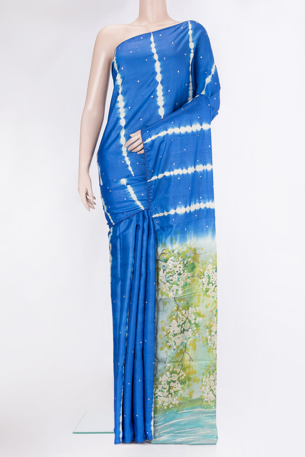 Royal Blue Tussar Silk Saree with Embroidery on the body and Fancy Border.  displayed on a mannequin