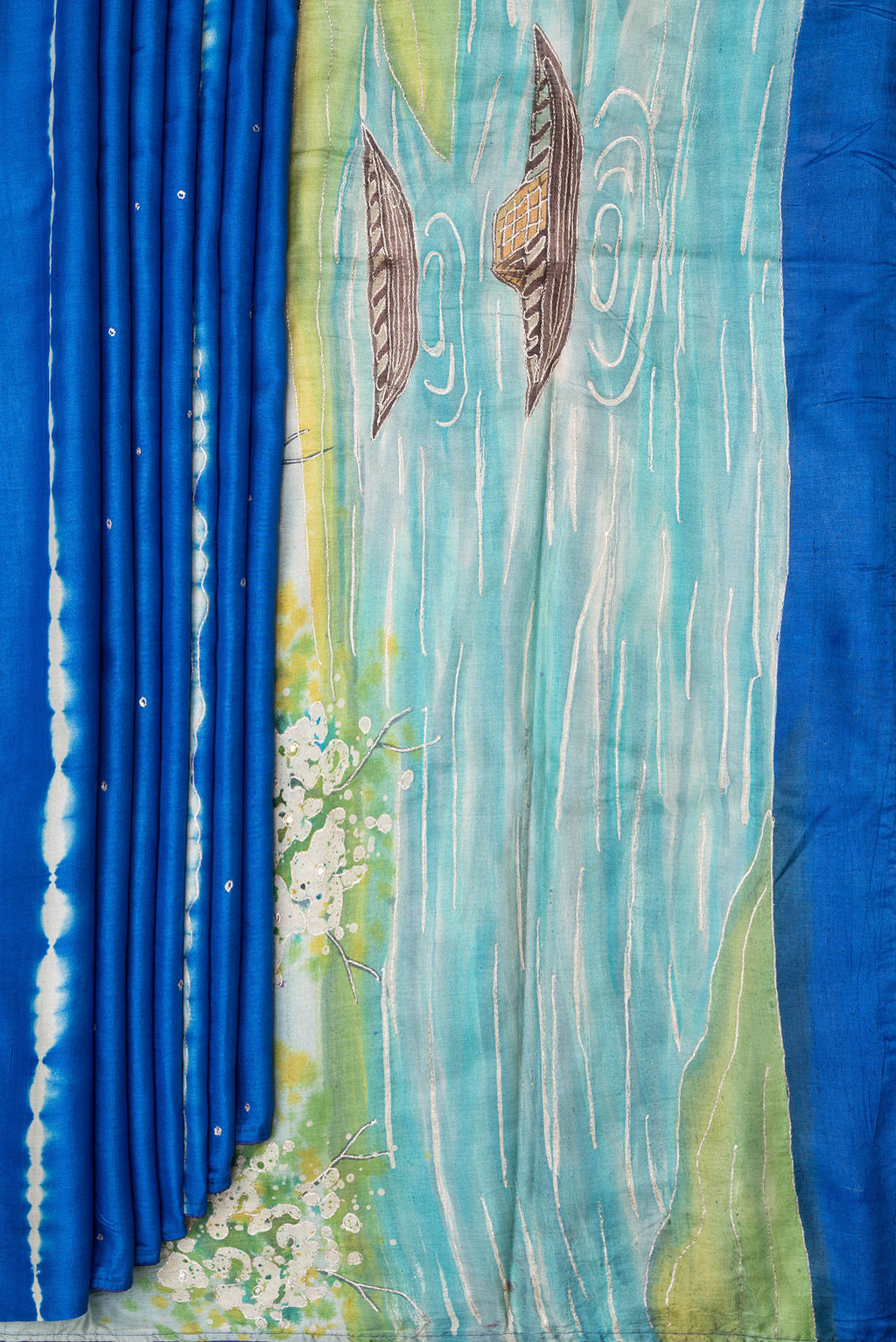 Pleats and pallu of Royal Blue Tussar Silk Saree with Embroidery on the body and Fancy Border. 