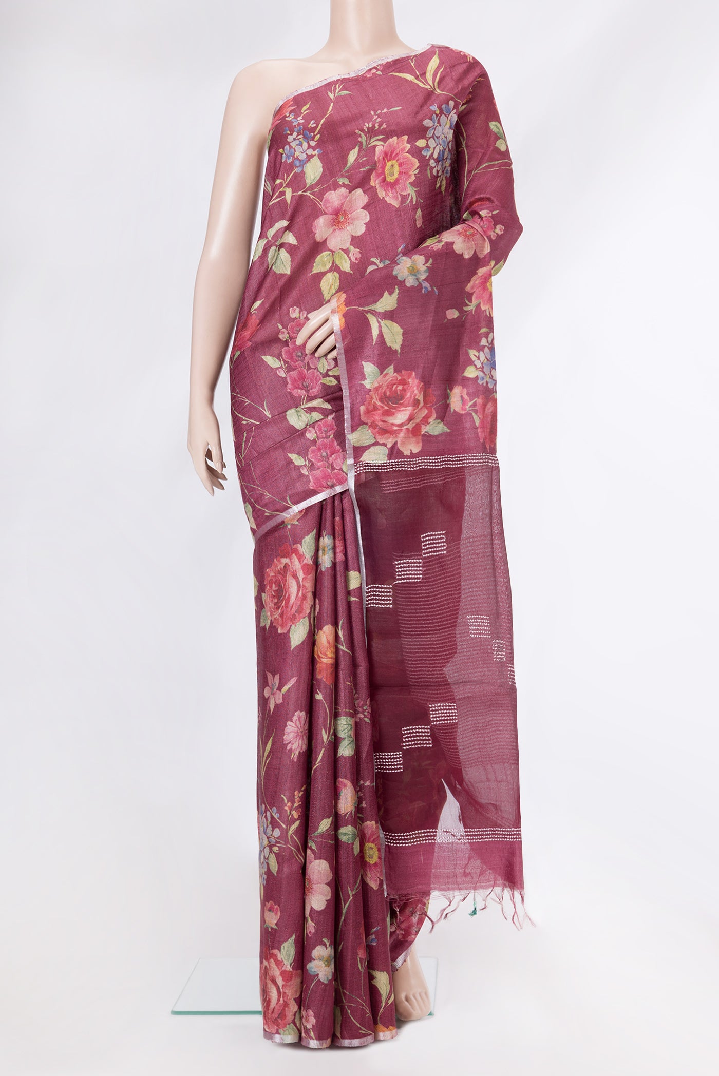 Maroon Dual Tone Tussar Silk Saree with Printed design on the body and Zari Border.  displayed on a mannequin
