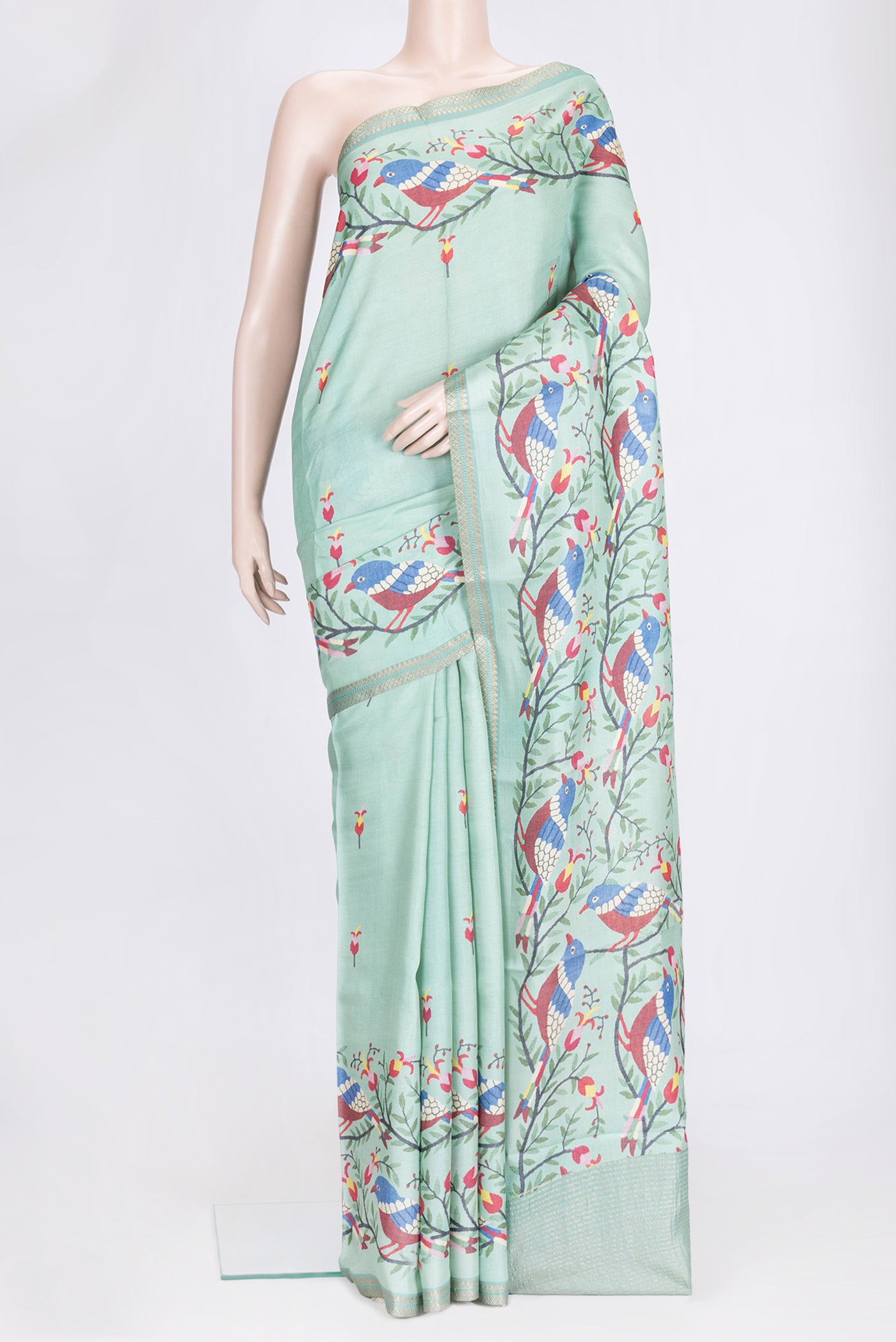 Sea Green Dual Tone Tussar Silk Saree with Printed design on the body and Zari Border.  displayed on a mannequin