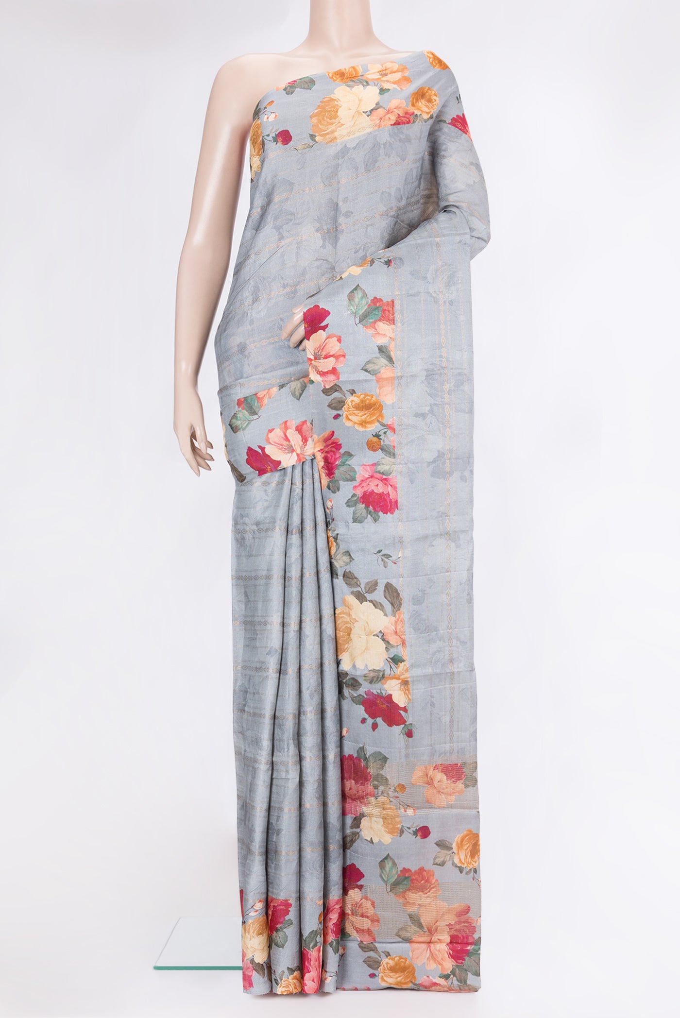 Grey Tussar Silk Saree with Stripes on the body and Fancy Border.  displayed on a mannequin