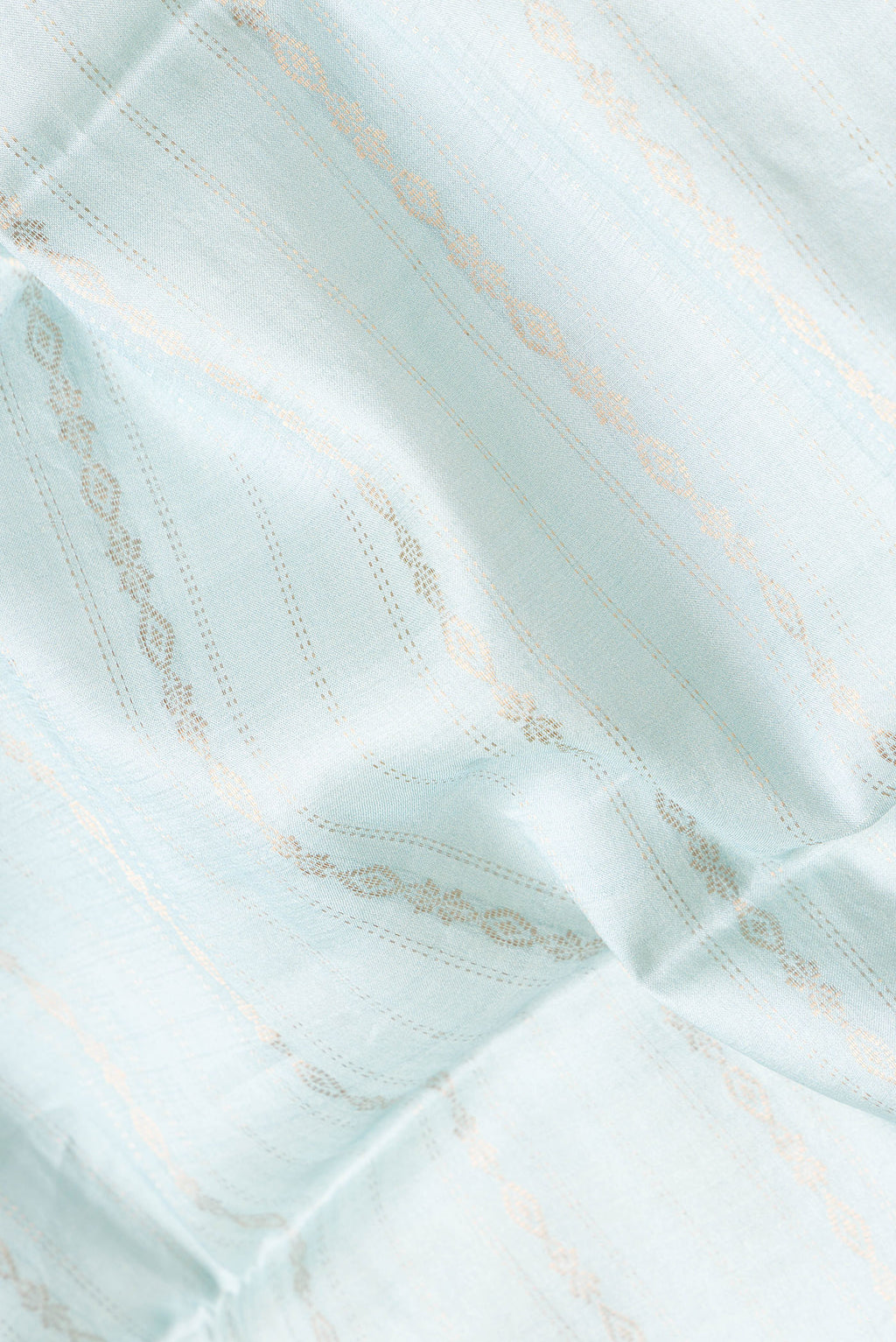 Close up of Sky Blue Dual Tone Tussar Silk Saree with Stripes on the body and Printed Border.  displaying folds