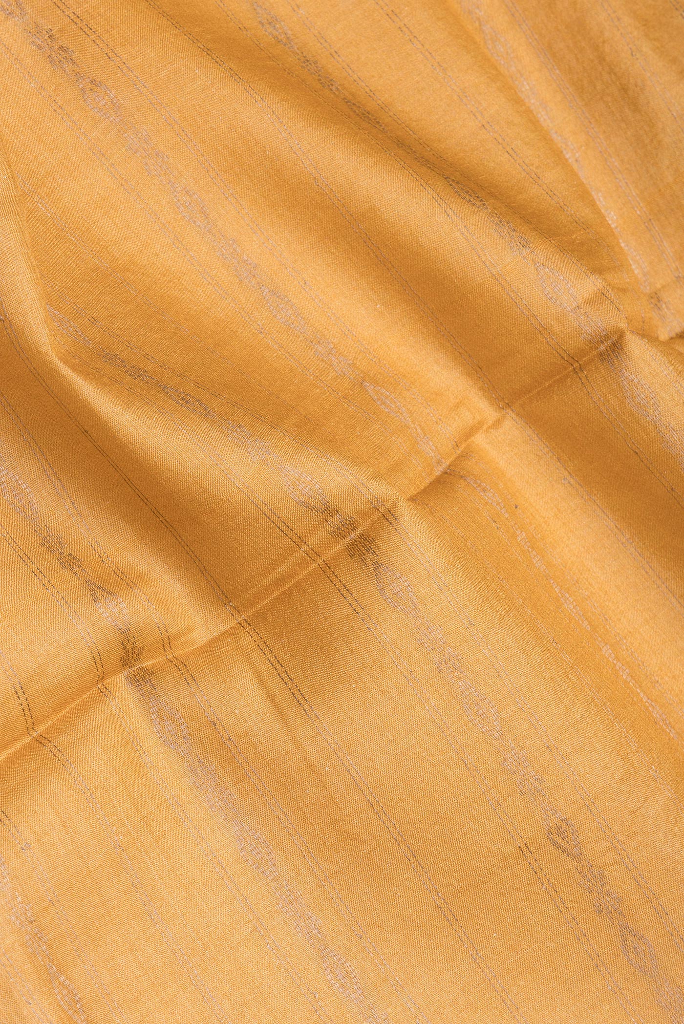 Close up of Sandal Tussar Silk Saree with Stripes on the body and Fancy Border.  displaying folds