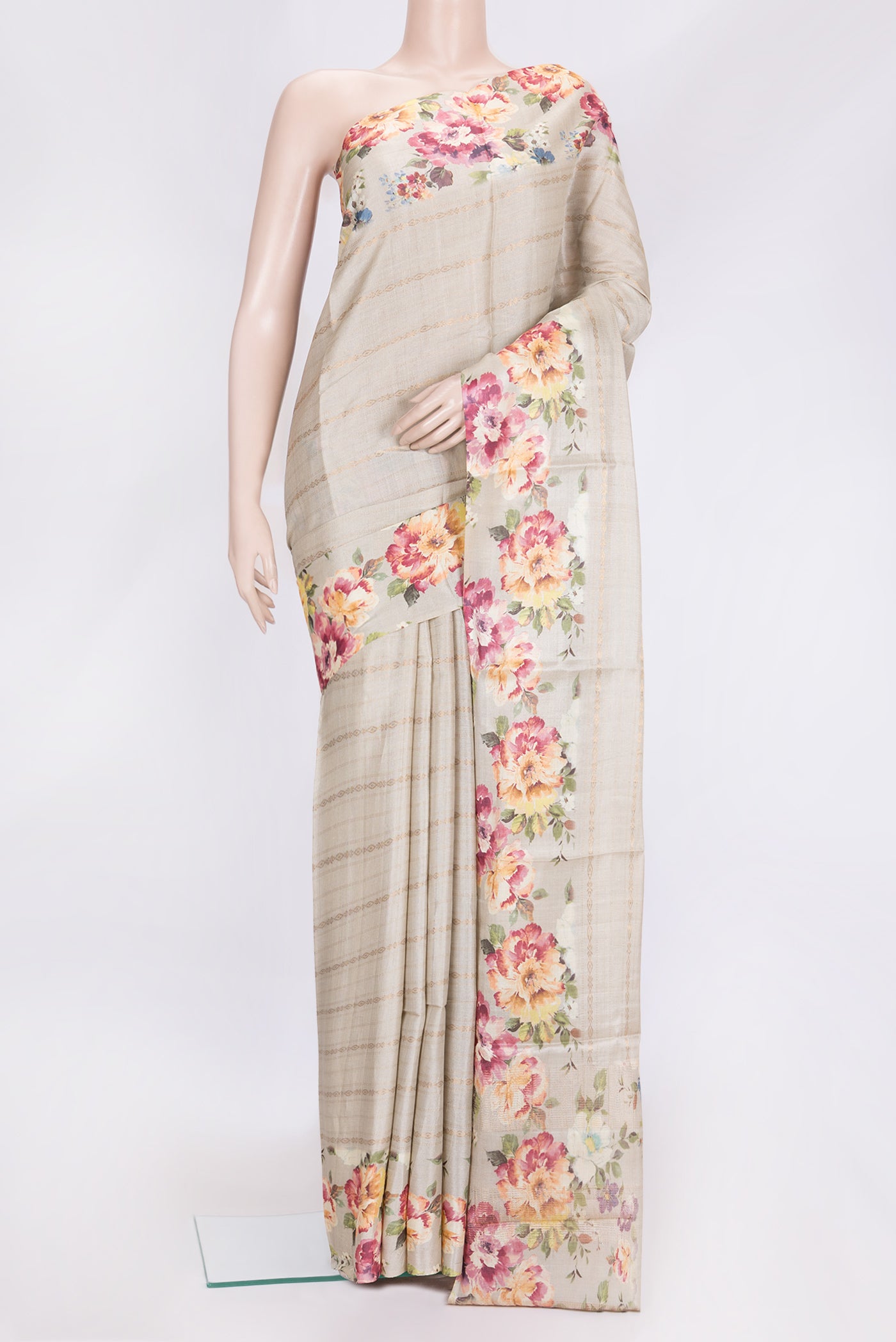 Beige Dual Tone Tussar Silk Saree with Stripes on the body and Printed Border.  displayed on a mannequin
