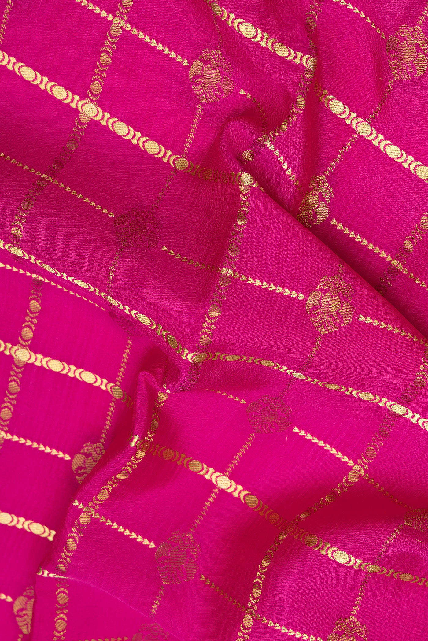 Close up of Pink Mysore Silk Saree with Checked design on the body and Zari Border.  displaying folds