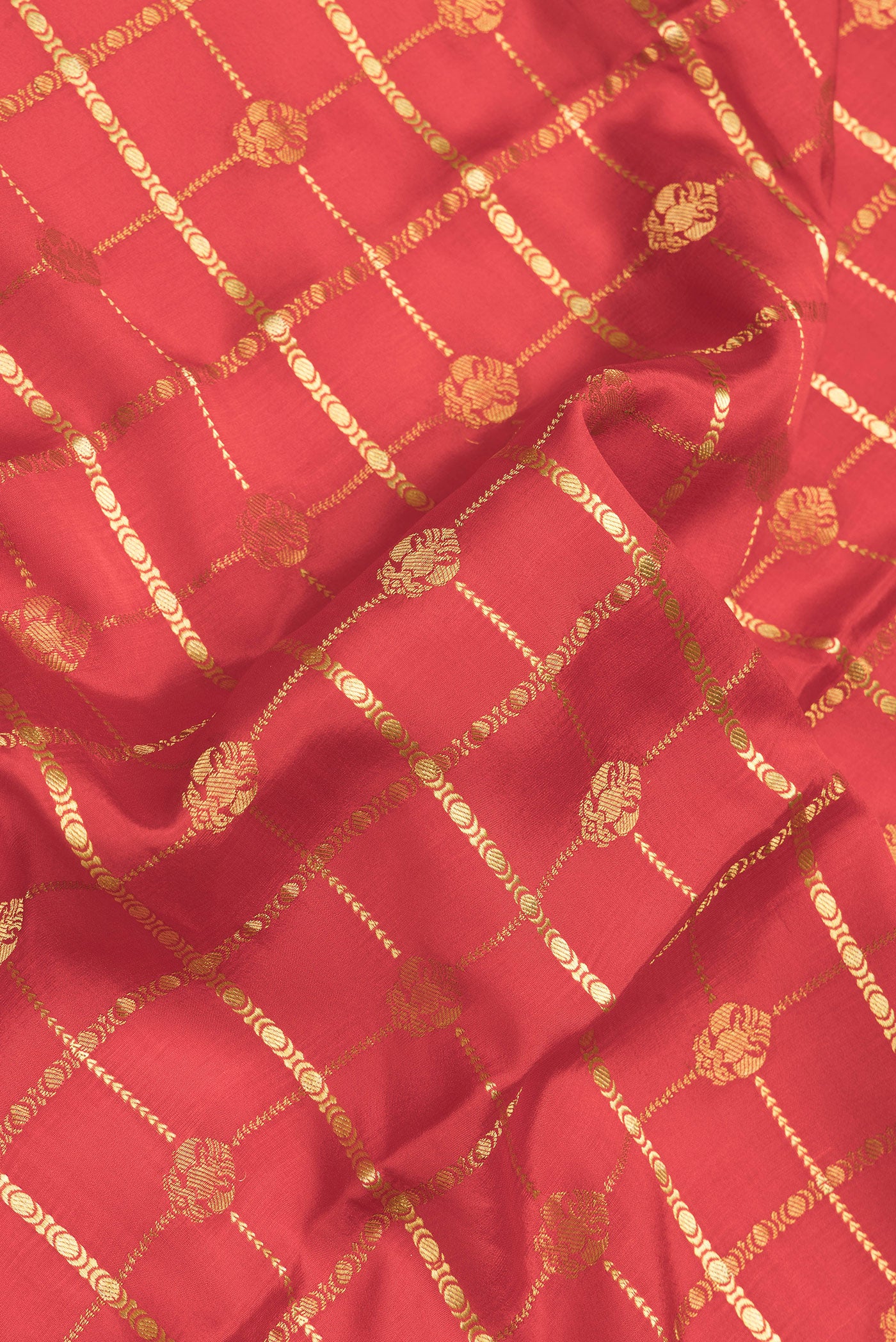 Close up of Red Dual Tone Mysore Silk Saree with Checked design on the body and Zari Border.  displaying folds