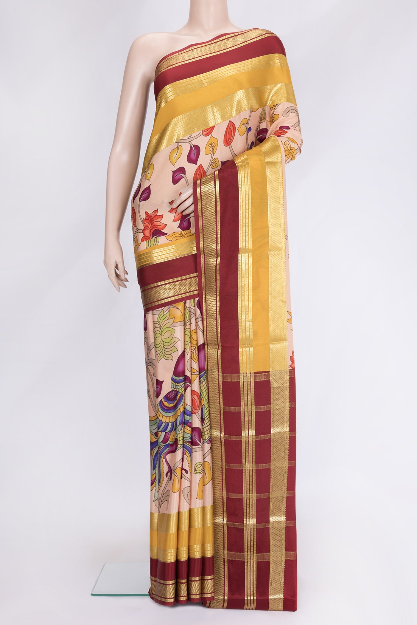Peach Dual Tone Mysore Silk Saree with Printed design on the body and Zari Border.  displayed on a mannequin
