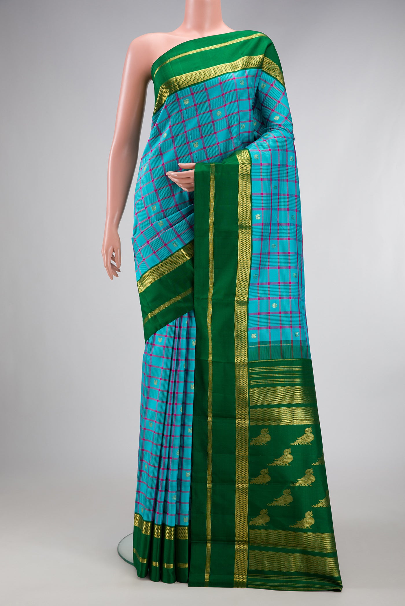 Sky Blue Kanjivaram Silk Saree with Checked design on the body and Zari Border.  displayed on a mannequin
