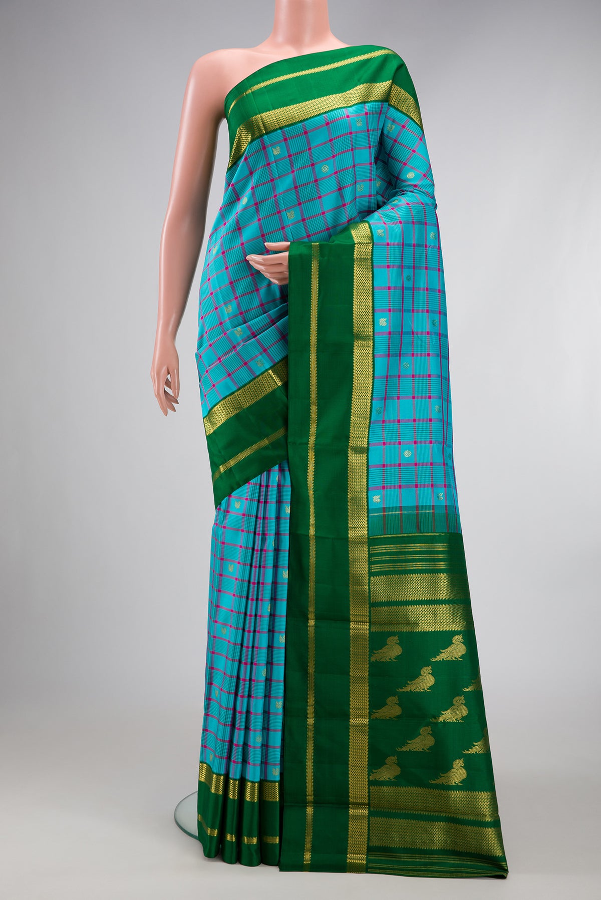 Sky Blue Kanjivaram Silk Saree with Checked design on the body and Zari Border.  displayed on a mannequin