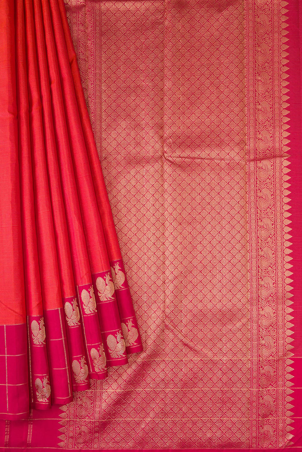 Pleats and pallu of Brick Orange Dual Tone Kanjivaram Silk Saree with Stripes on the body and Checks Border. 