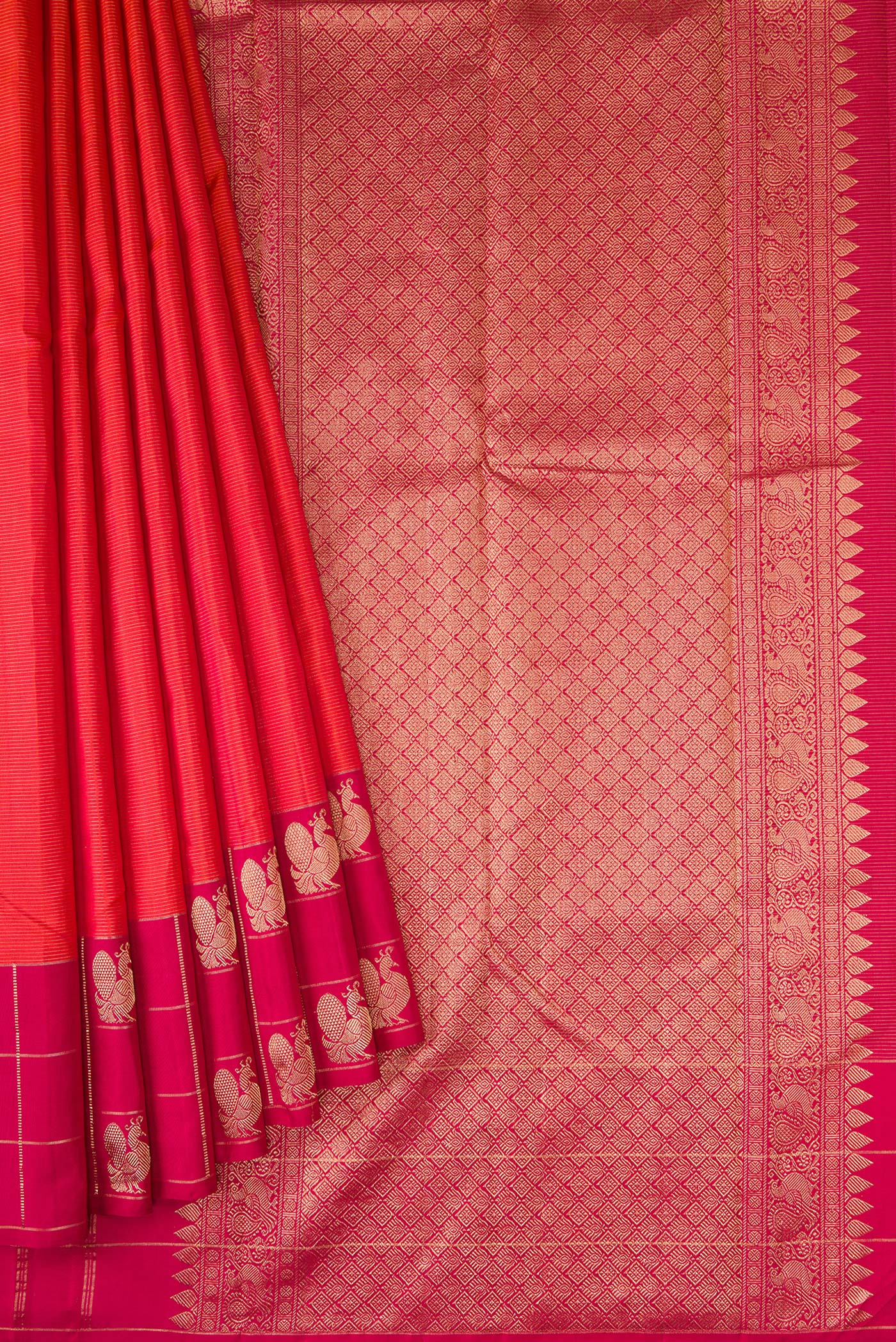 Pleats and pallu of Brick Orange Dual Tone Kanjivaram Silk Saree with Stripes on the body and Checks Border. 