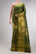 Bottle Green Kanchipuram Silk Saree with Zari Brocade on the body and Zari Border.  displayed on a mannequin