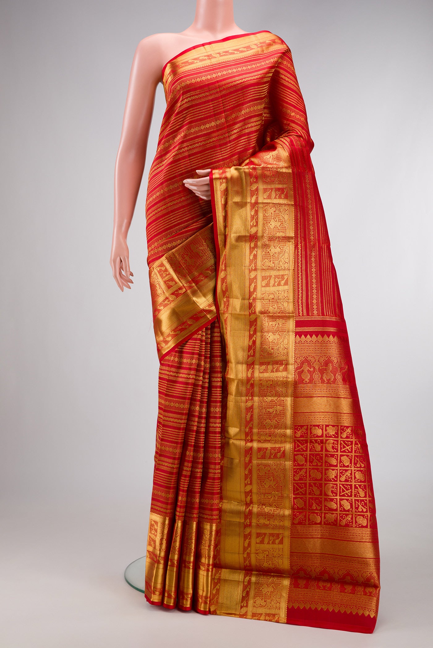 Red Dual Tone Kanchipuram Silk Saree with Zari Brocade on the body and Fancy Border.  displayed on a mannequin
