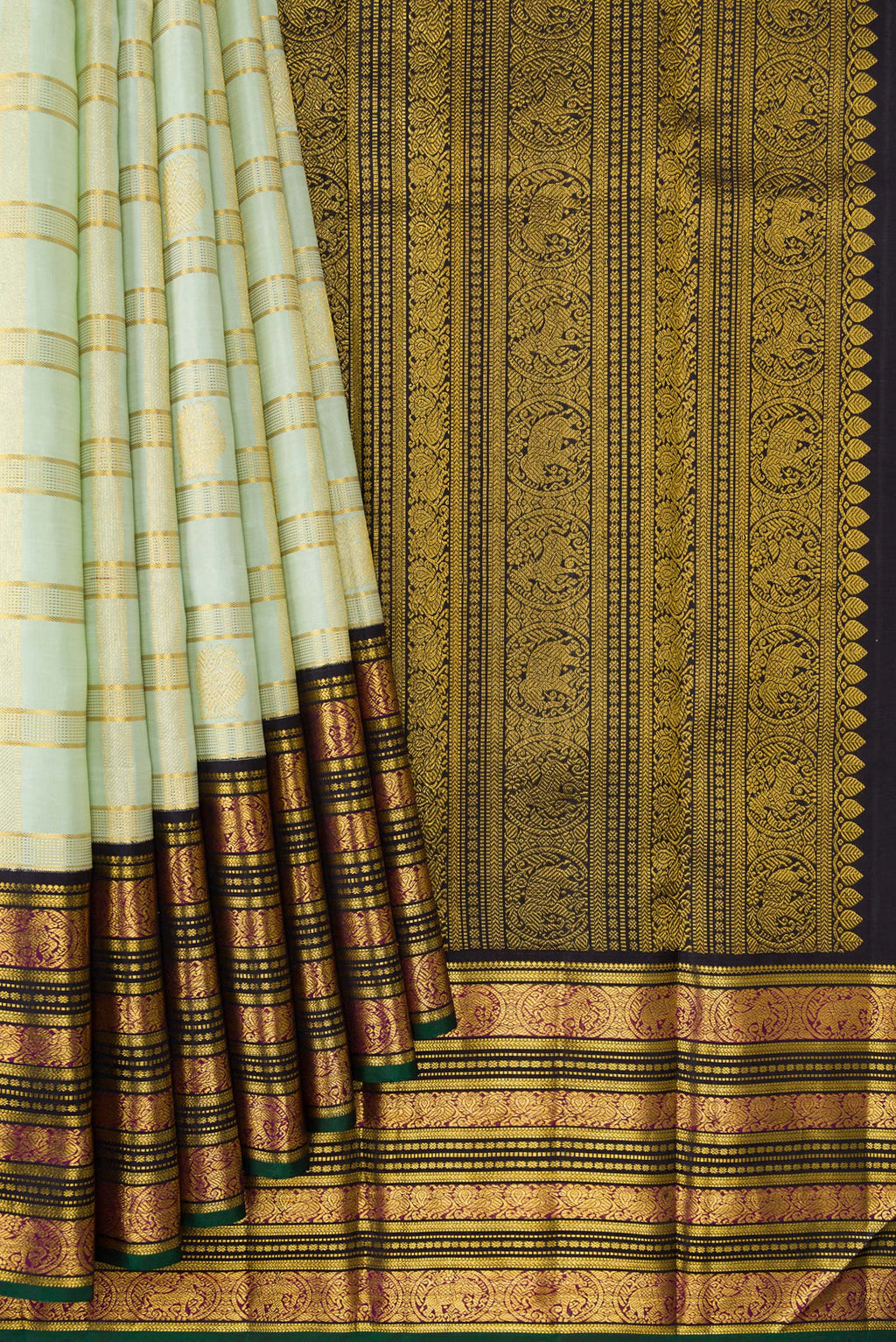 Pleats and pallu of Pista Green Dual Tone Kanchipuram Silk Saree with Checked design on the body and Zari Border. 