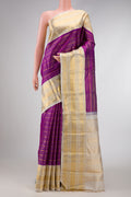 Magenta Dual Tone Kanchipuram Silk Saree with Stripes on the body and Zari Border.  displayed on a mannequin