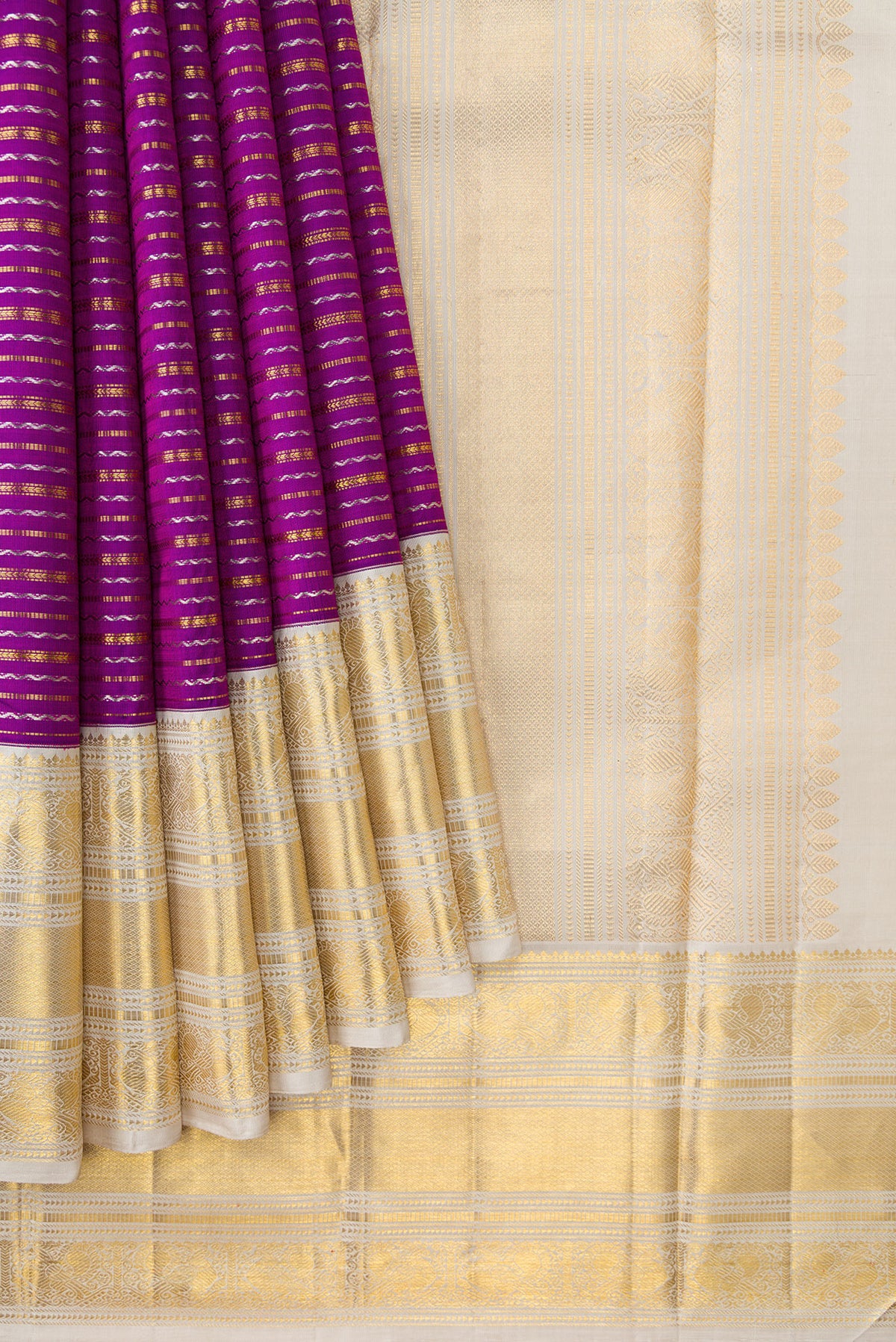 Pleats and pallu of Magenta Dual Tone Kanchipuram Silk Saree with Stripes on the body and Zari Border. 