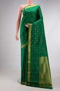 Pure Silk Pure Zari Green Dual Tone Kanjivaram Saree with Zari Butta on the body and Zari Border.  displayed on a mannequin