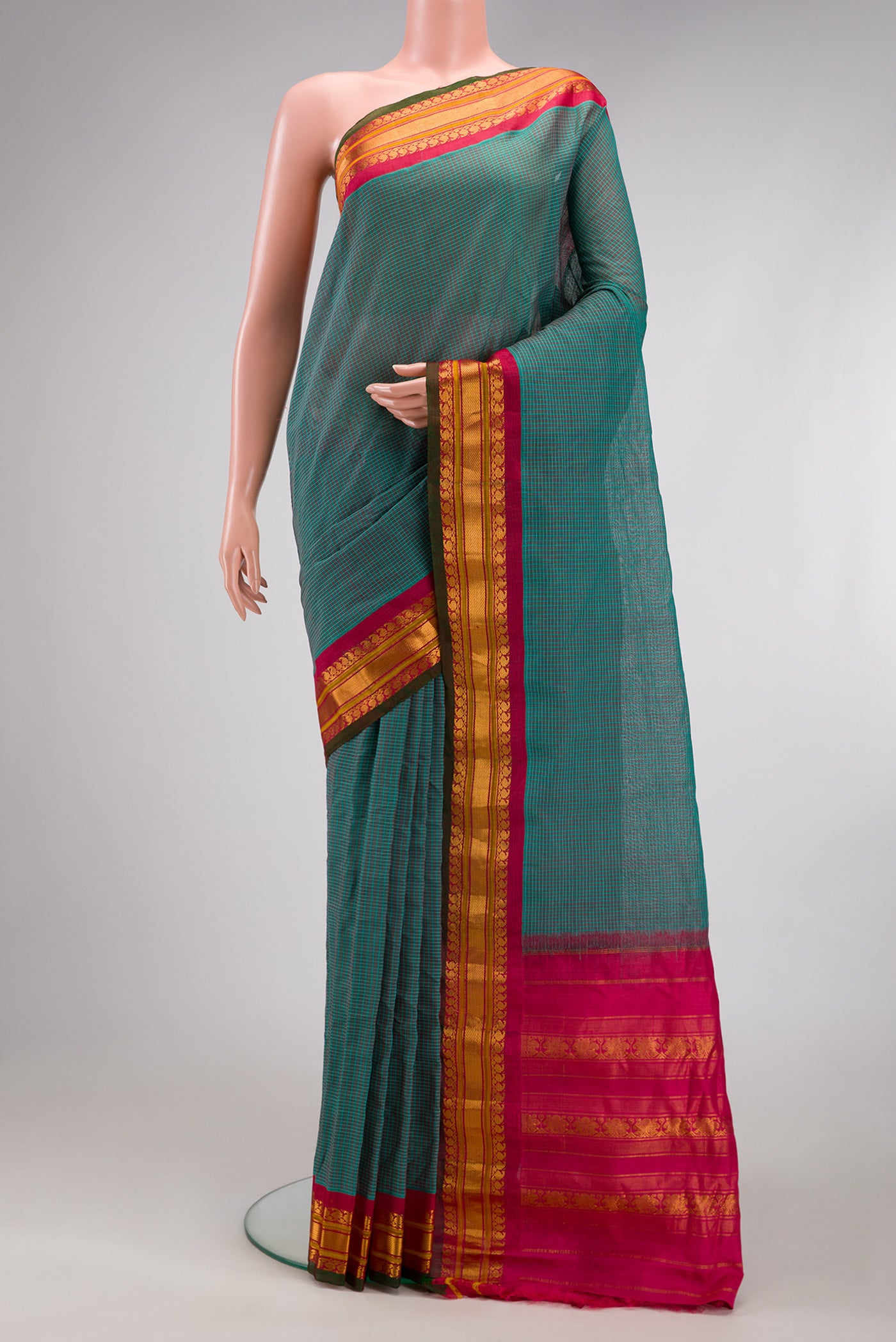 Purple Gadwal Silk Cotton Saree with Checked design on the body and Zari Border.  displayed on a mannequin