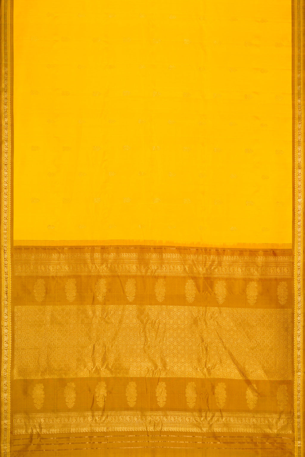 Flat view of Yellow Dual Tone Gadwal Silk Saree with Zari Butta on the body and Zari Border. 