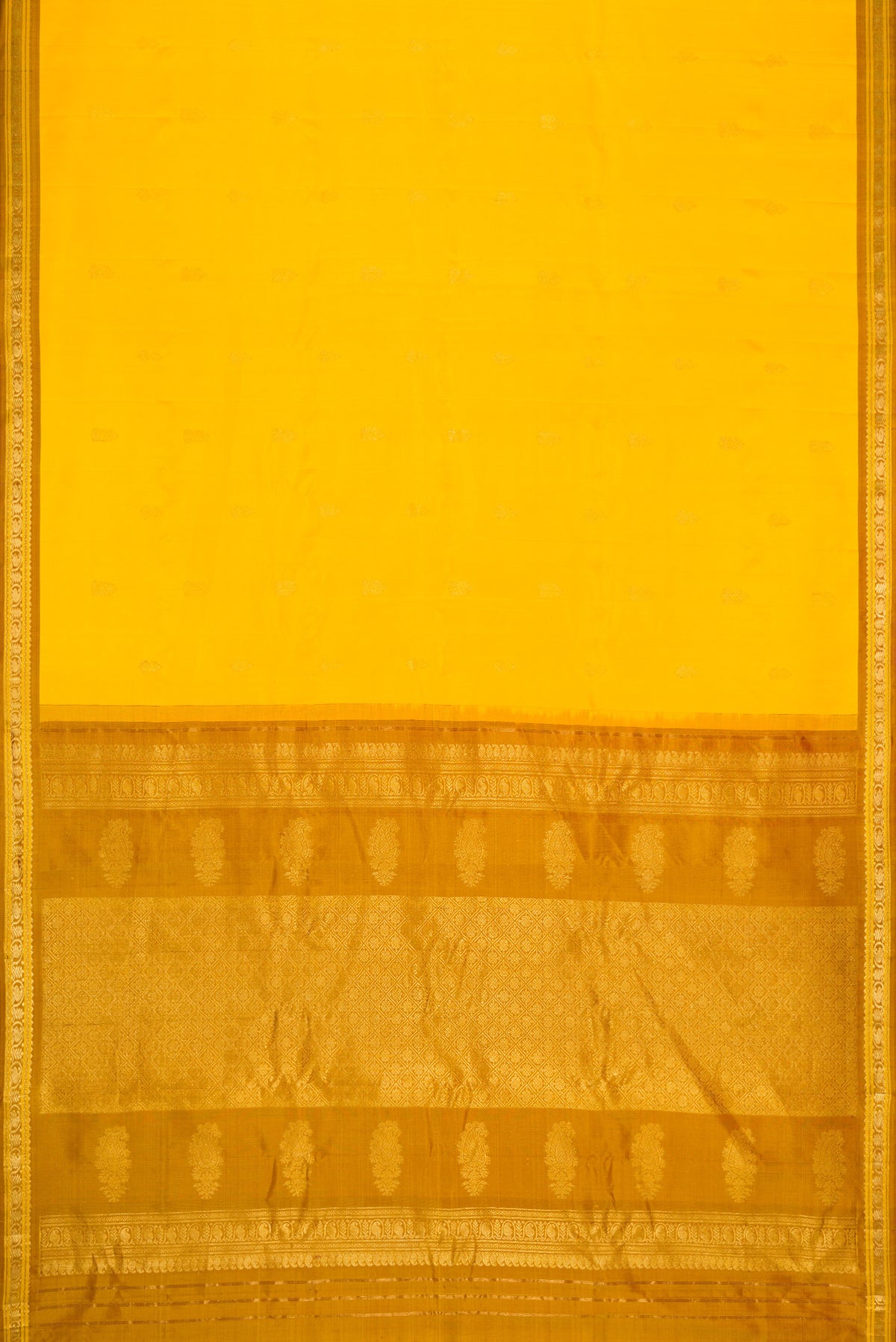 Flat view of Yellow Dual Tone Gadwal Silk Saree with Zari Butta on the body and Zari Border. 
