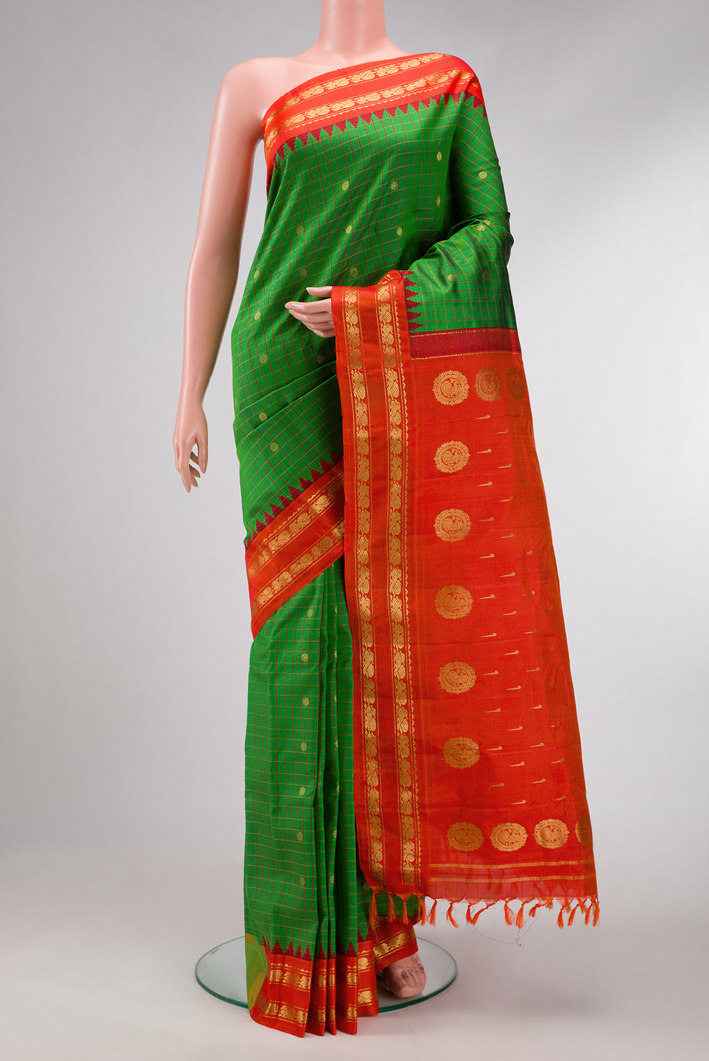 Bottle Green Dual Tone Gadwal Silk Saree with Checked design on the body and Zari Border.  displayed on a mannequin