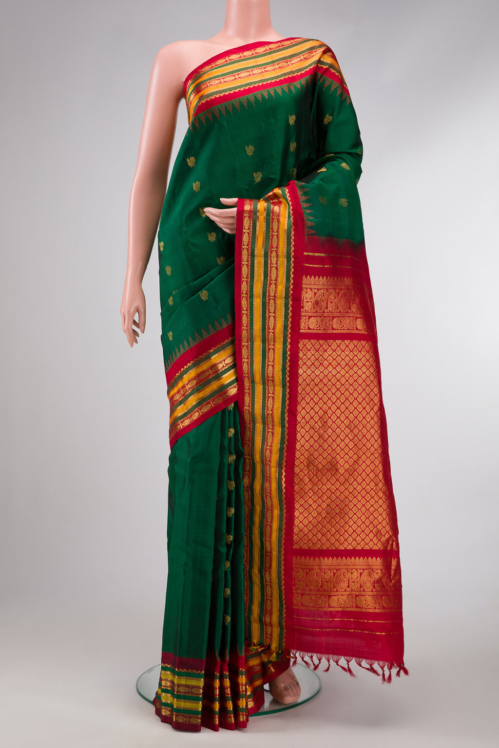 Bottle Green Dual Tone Gadwal Silk Saree with Zari Butta on the body and Zari Border.  displayed on a mannequin