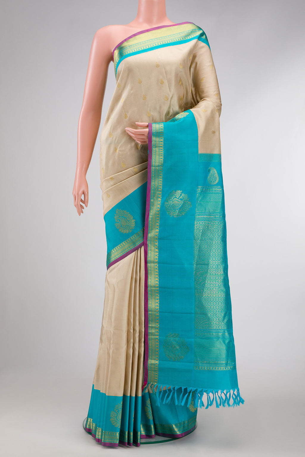 Beige Dual Tone Gadwal Silk Saree with Zari Butta on the body and Fancy Border.  displayed on a mannequin