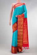 Sky Blue Dual Tone Gadwal Silk Saree with Zari Butta on the body and Temple Border.  displayed on a mannequin