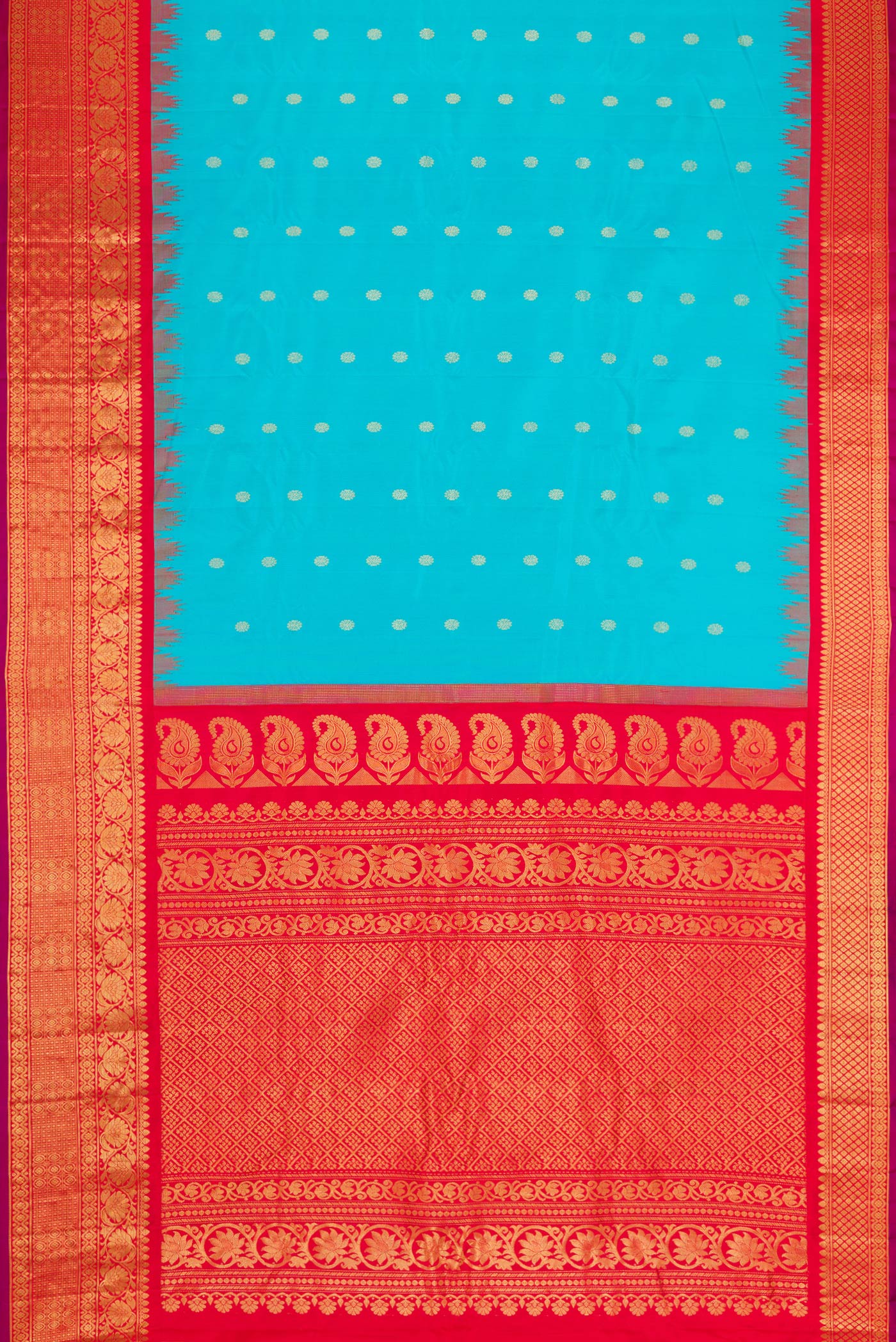 Flat view of Sky Blue Dual Tone Gadwal Silk Saree with Zari Butta on the body and Temple Border. 