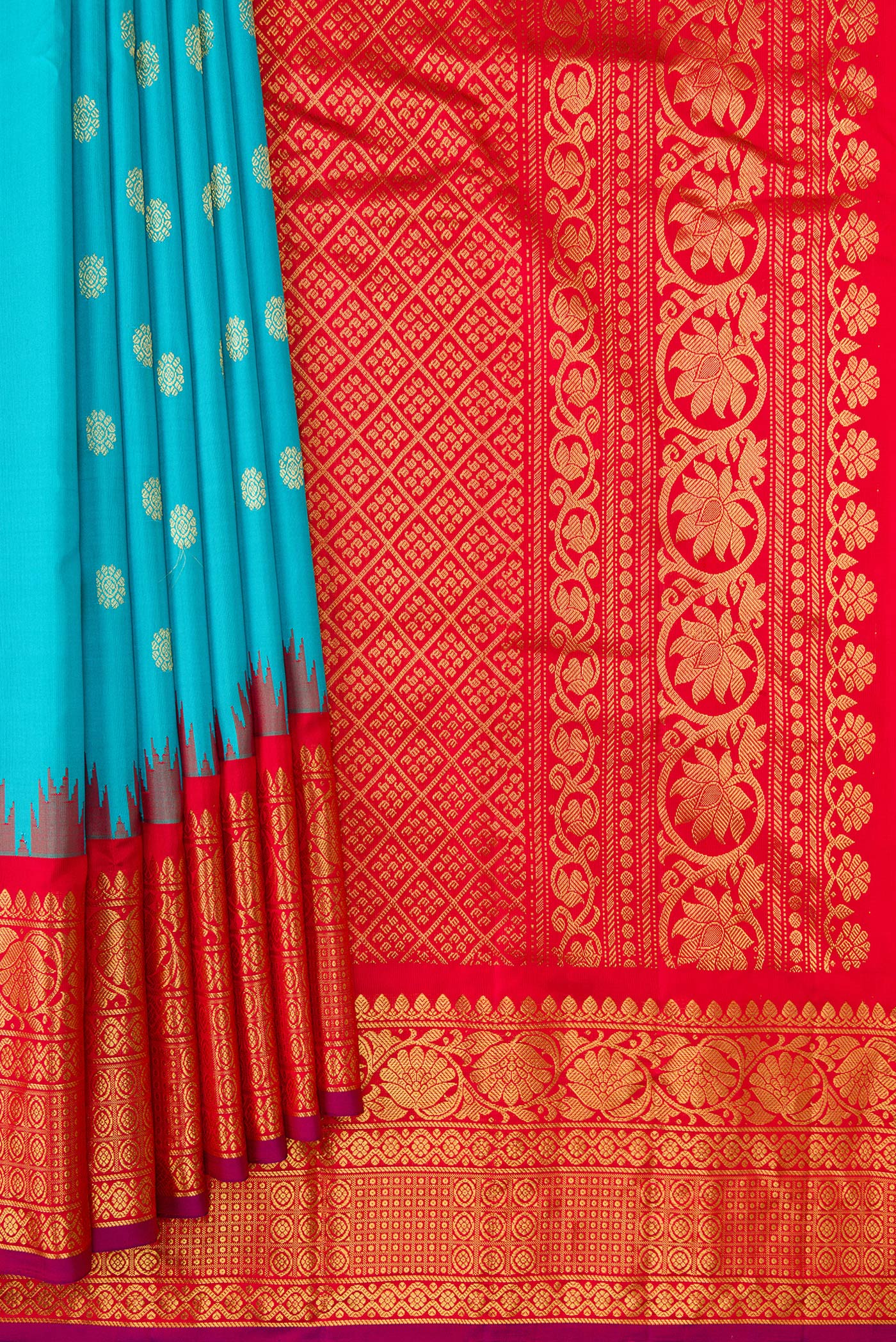 Pleats and pallu of Sky Blue Dual Tone Gadwal Silk Saree with Zari Butta on the body and Temple Border. 