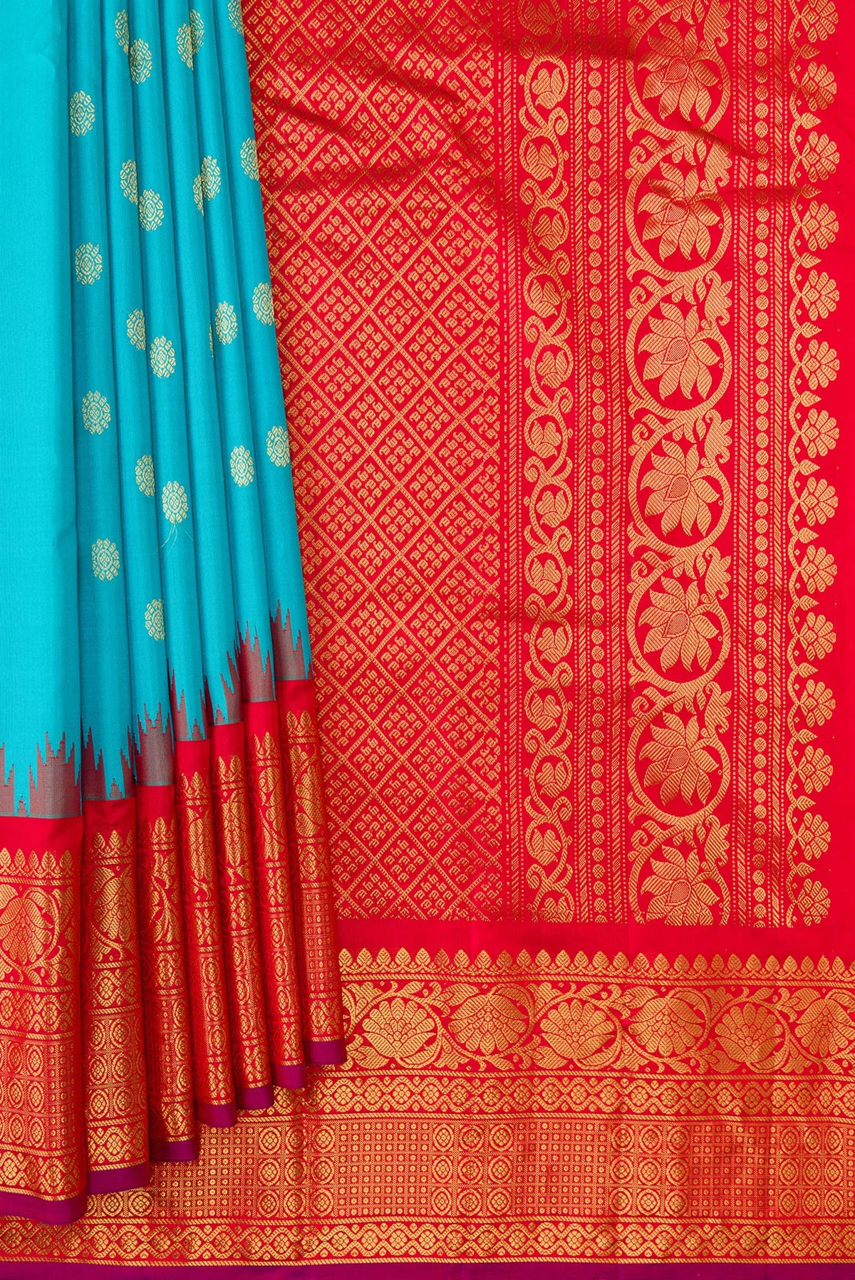 Pleats and pallu of Sky Blue Dual Tone Gadwal Silk Saree with Zari Butta on the body and Temple Border. 