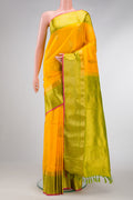 Yellow Dual Tone Gadwal Silk Saree with Zari And Thread Butta on the body and Zari Border.  displayed on a mannequin