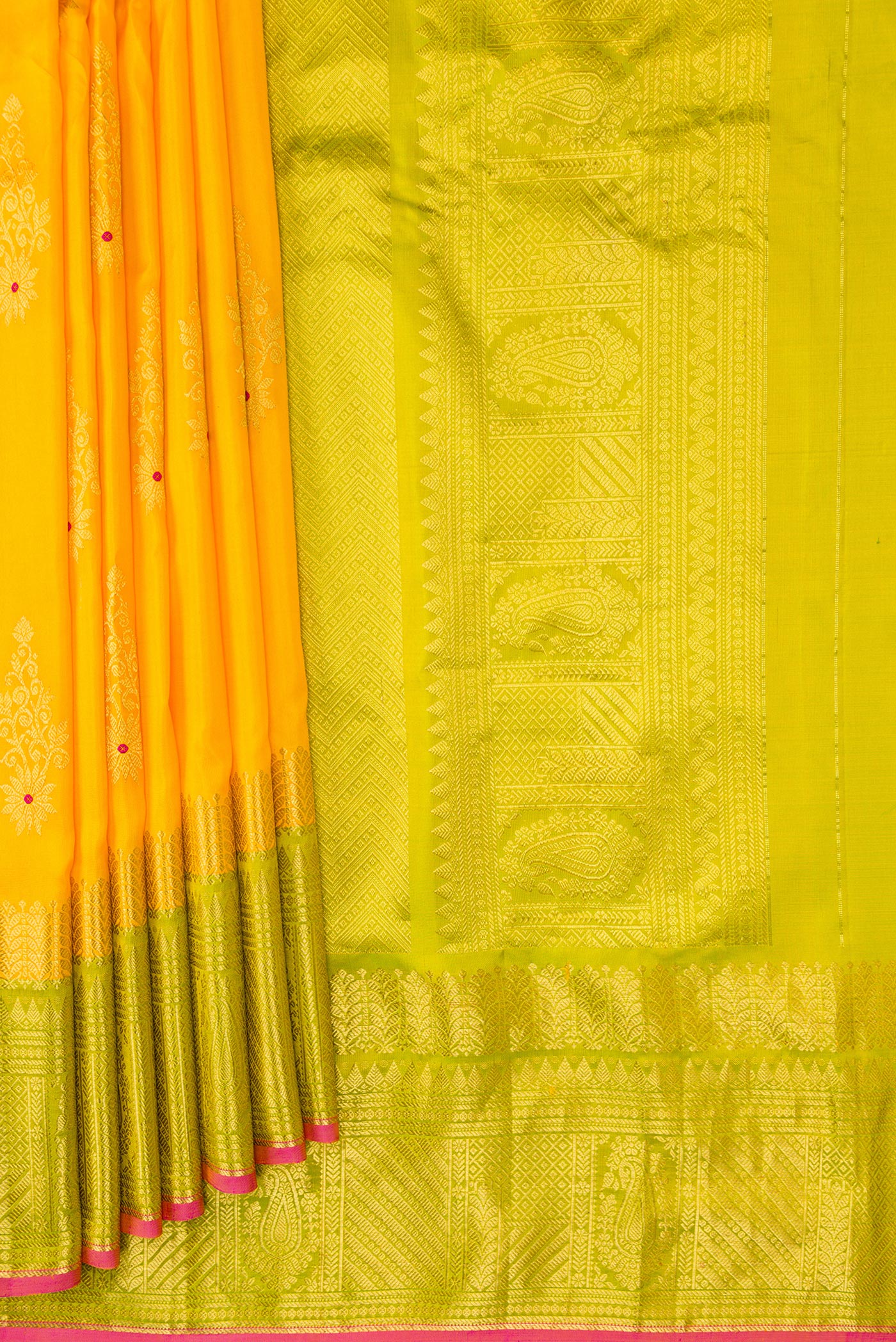 Pleats and pallu of Yellow Dual Tone Gadwal Silk Saree with Zari And Thread Butta on the body and Zari Border. 