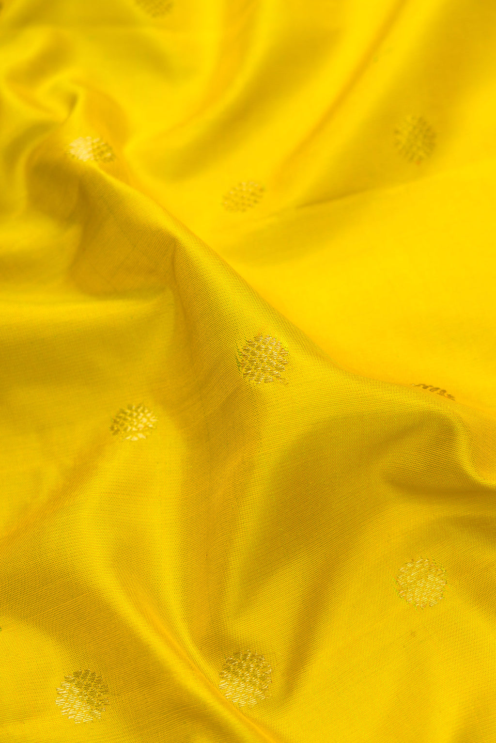 Close up of Parrot Green Dual Tone Gadwal Silk Saree with Zari Butta on the body and Temple Border.  displaying folds