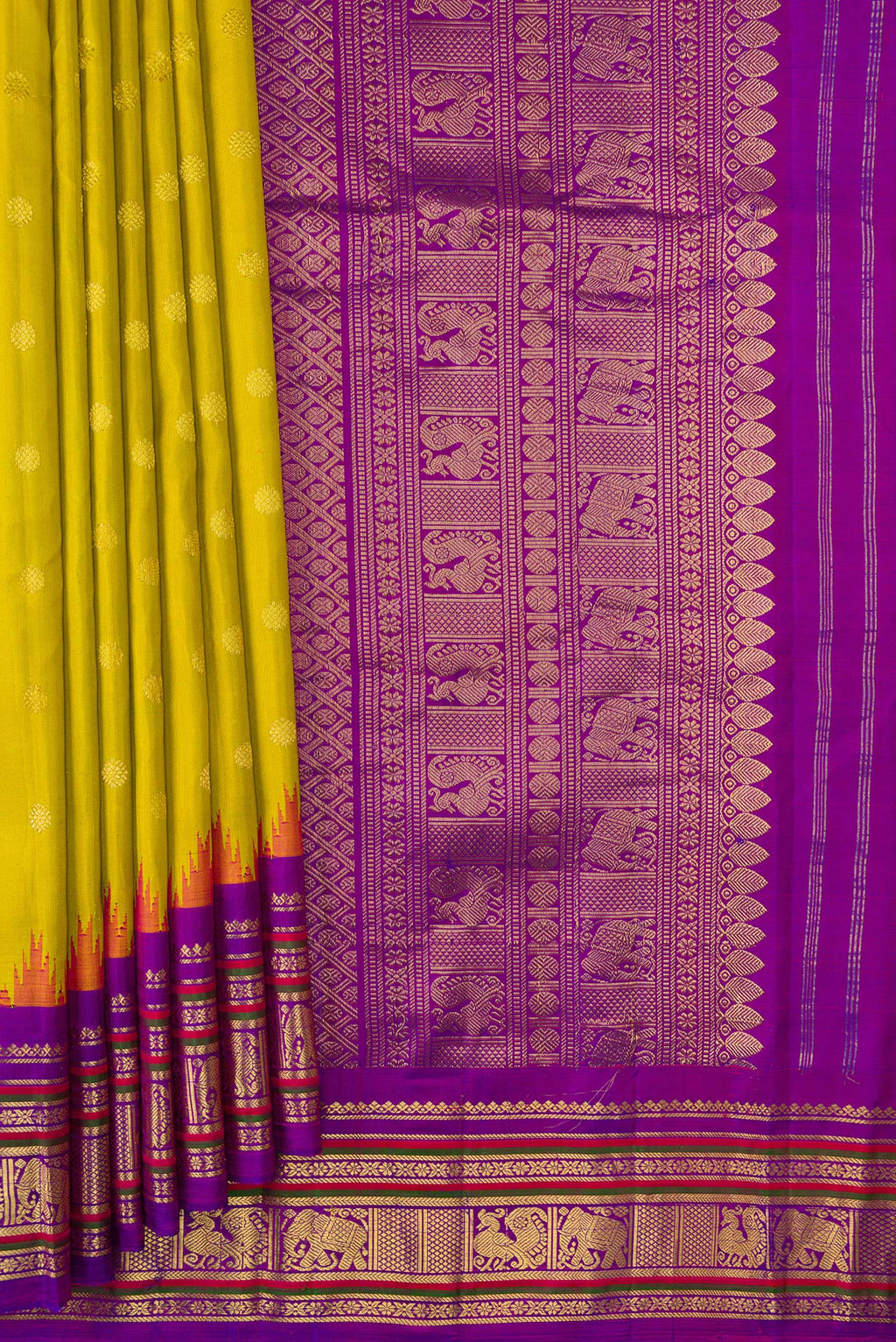 Pleats and pallu of Parrot Green Dual Tone Gadwal Silk Saree with Zari Butta on the body and Temple Border. 