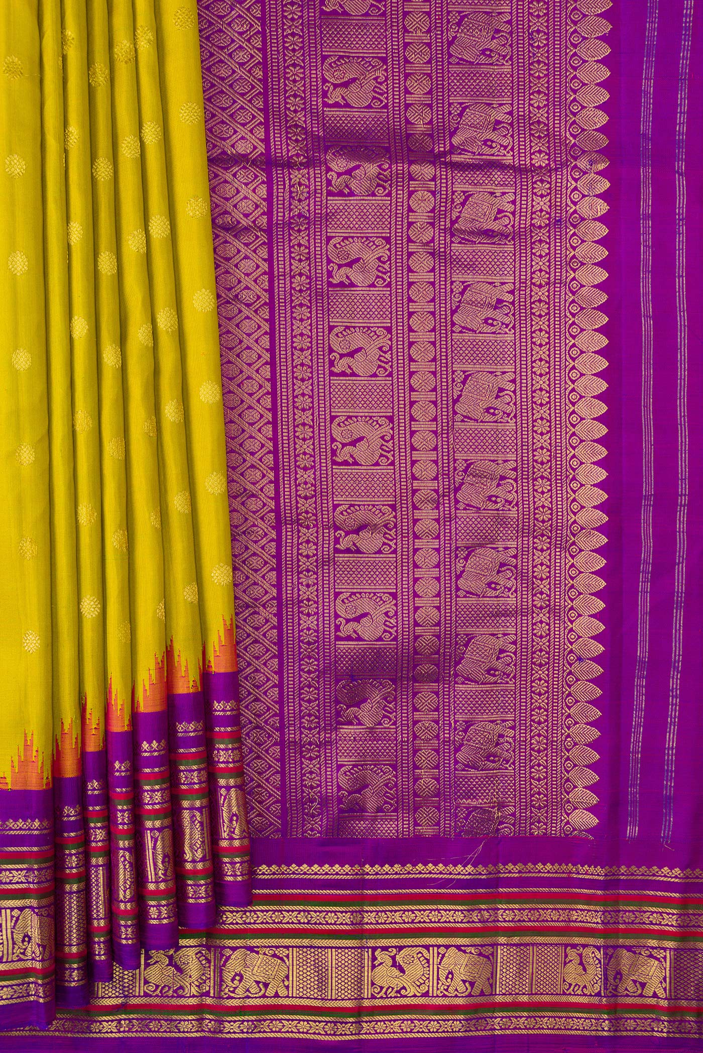 Pleats and pallu of Parrot Green Dual Tone Gadwal Silk Saree with Zari Butta on the body and Temple Border. 