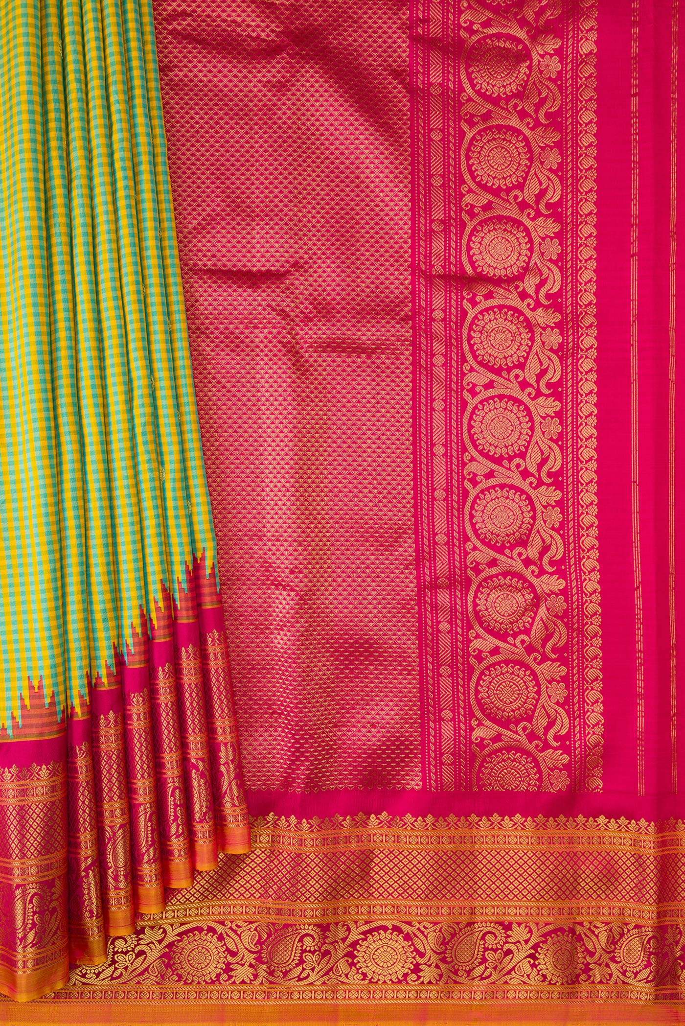 Pleats and pallu of Sky Blue and Yellow Color Gadwal Silk Saree with Checked design on the body and Temple Border. 
