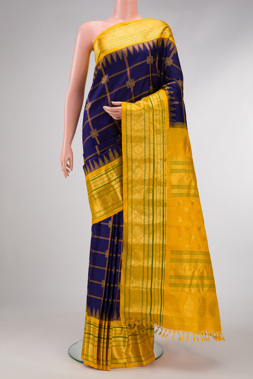 Navy Blue Dual Tone Gadwal Silk Saree with Checked design on the body and Temple Border.  displayed on a mannequin