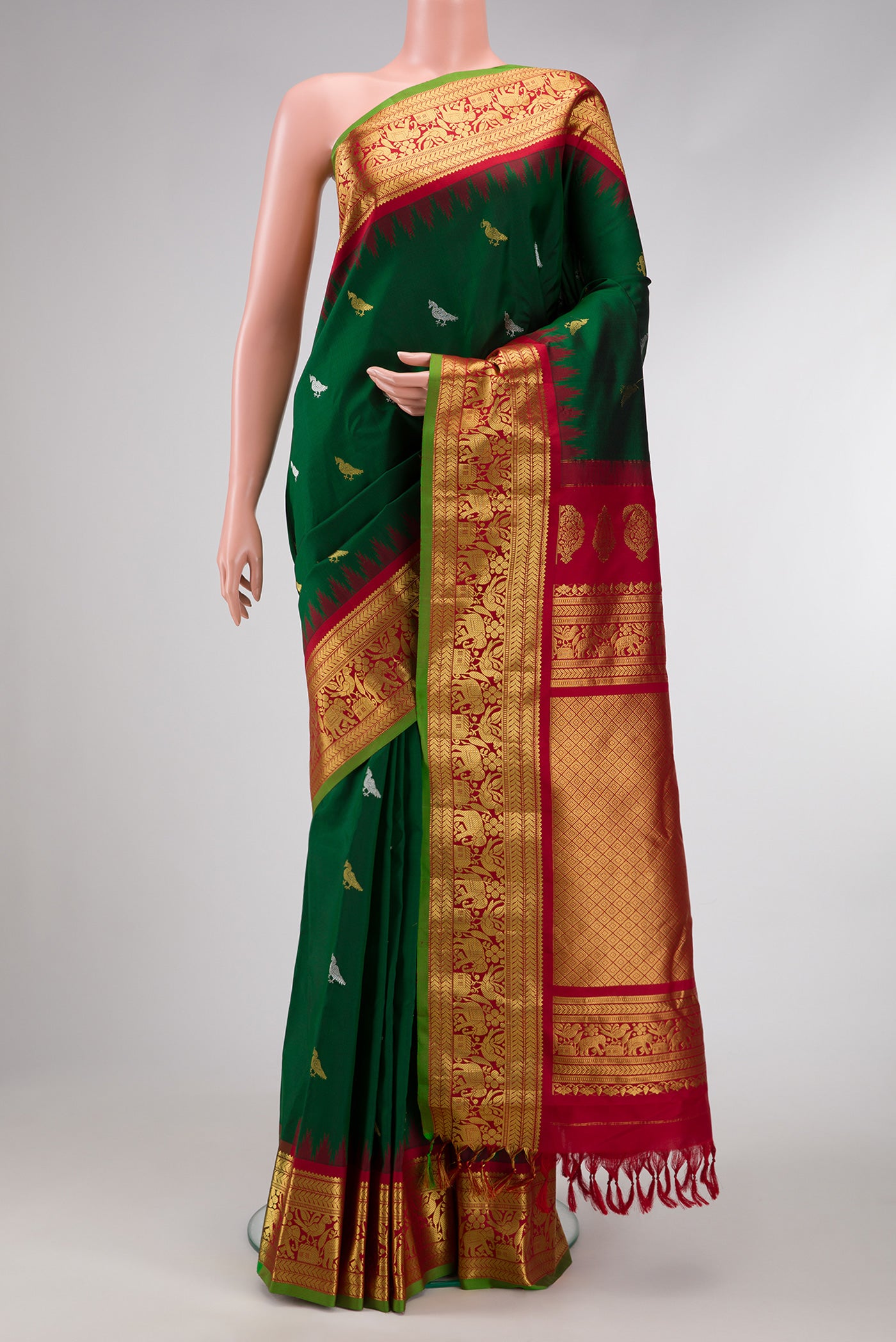 Bottle Green Dual Tone Gadwal Silk Saree with Zari Butta on the body and Zari Border.  displayed on a mannequin