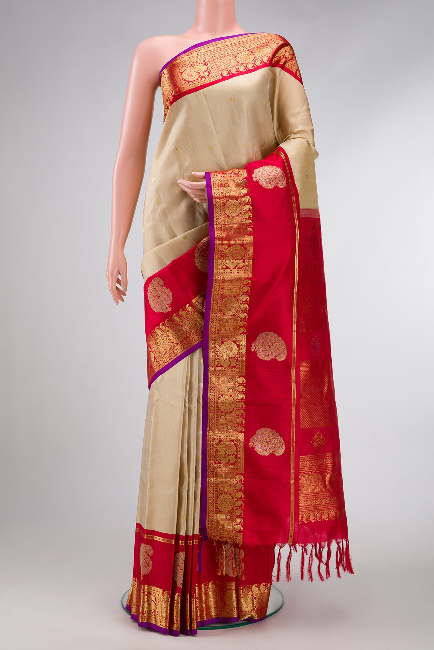 Beige Dual Tone Gadwal Silk Saree with Zari Butta on the body and Zari Border.  displayed on a mannequin