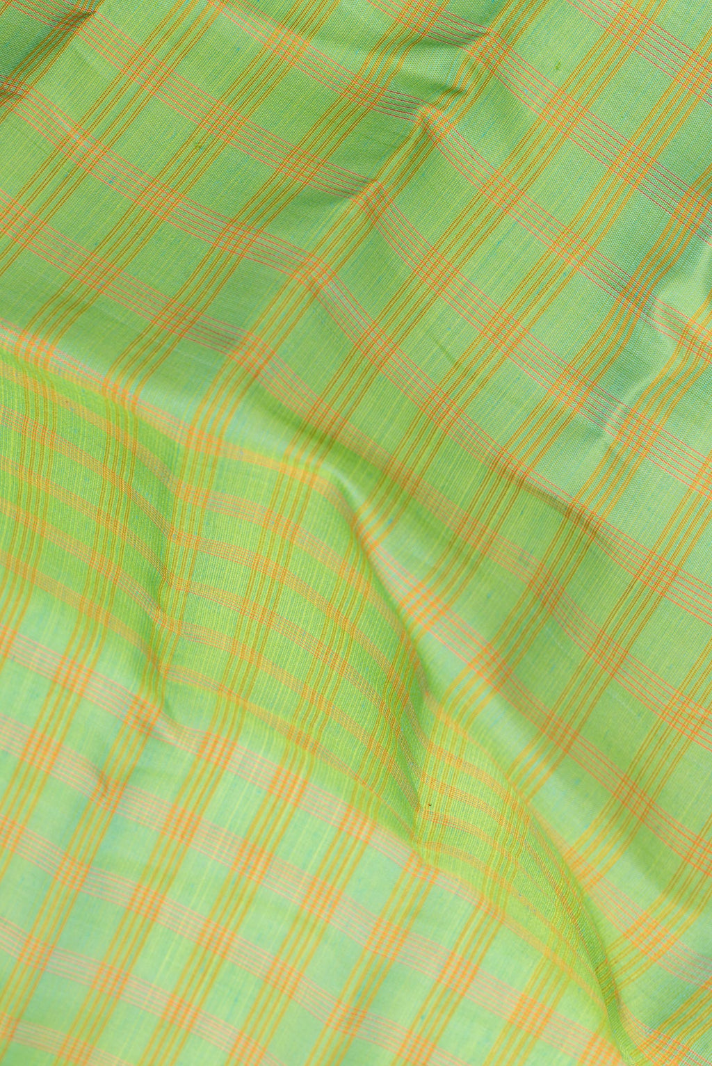 Close up of Pure Silk Green Dual Tone Gadwal Saree with Checked design on the body and Zari Border.  displaying folds
