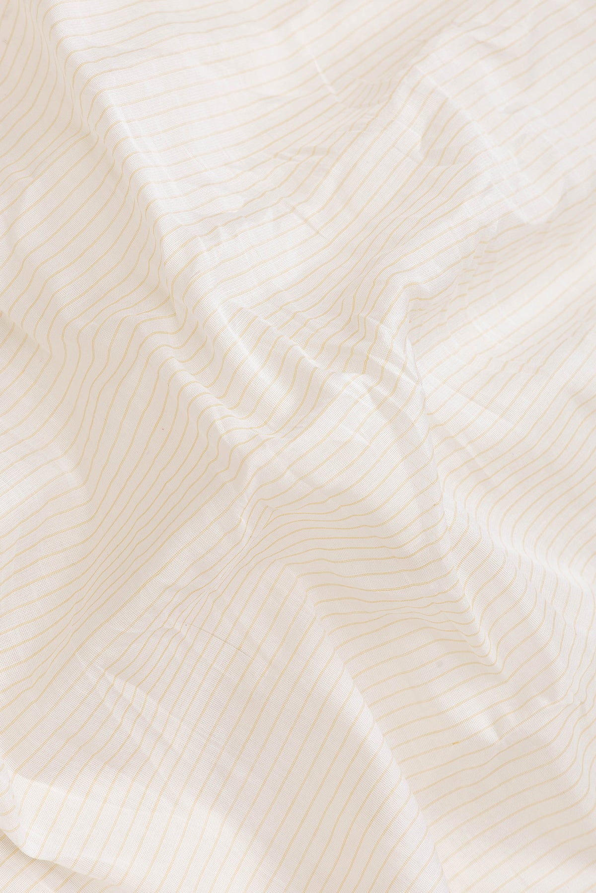 Close up of Mustard Dual Tone Gadwal Silk Saree with Stripes on the body and Zari Border.  displaying folds