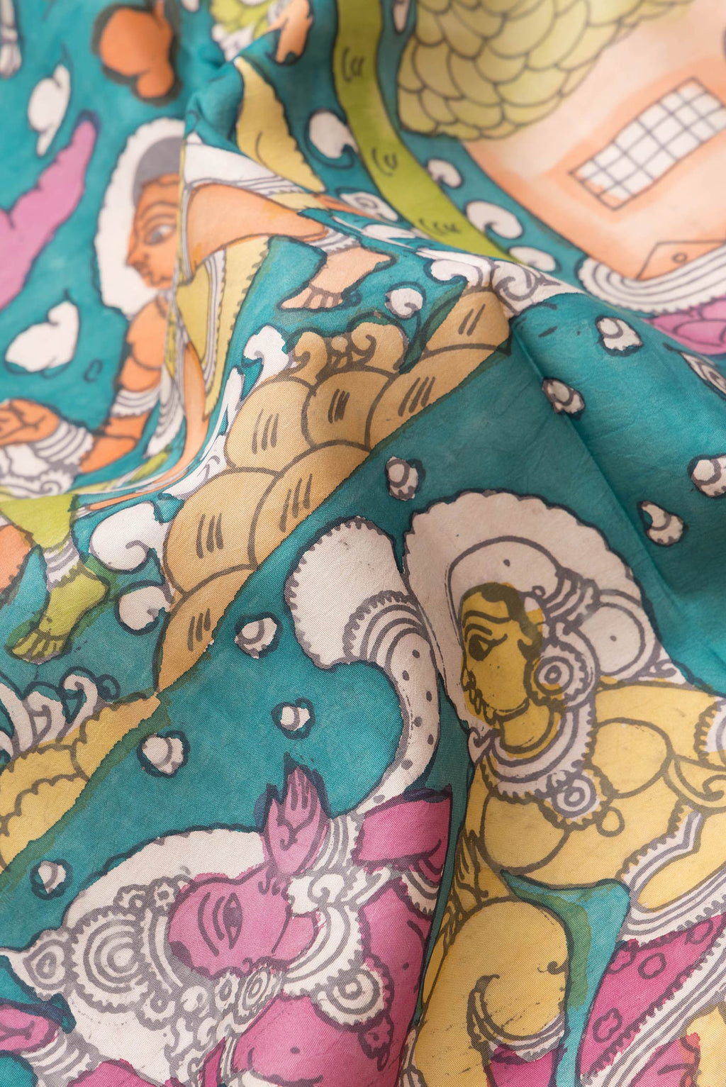 Close up of Rose pink Kanchipuram Silk Saree with kalamkari Print on the body and Zari Border.  displaying folds