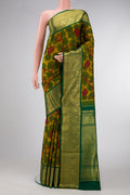 Mehandi Green Dual Tone Kanchipuram Silk Saree with kalamkari Print on the body and Zari Border.  displayed on a mannequin