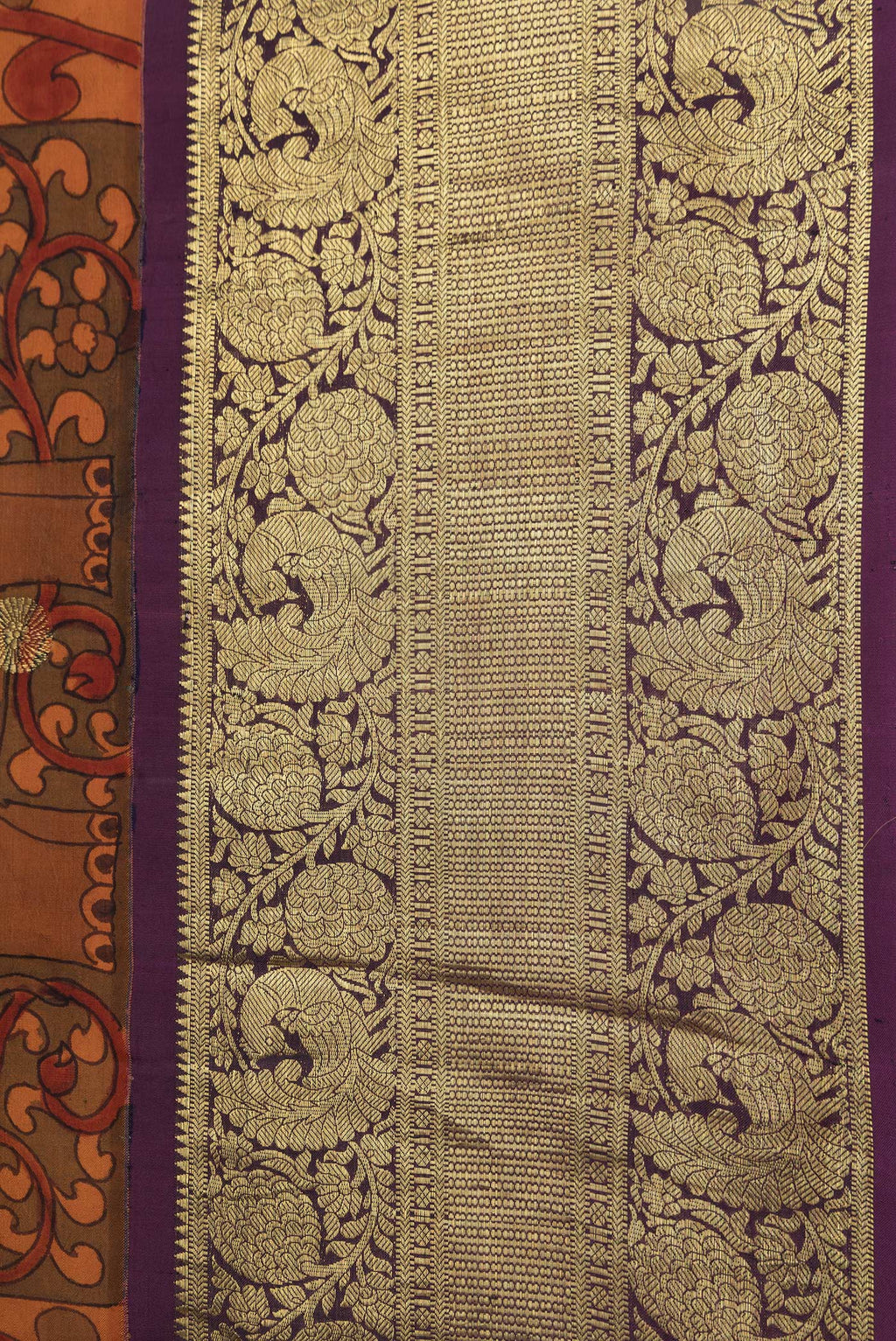 Border image of Orange Dual Tone Kanchipuram Silk Saree with kalamkari Print on the body and Zari Border. 