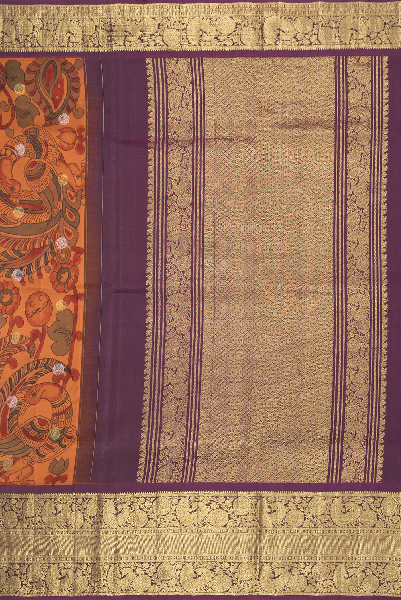 Close up image of the pallu of Orange Dual Tone Kanchipuram Silk Saree with kalamkari Print on the body and Zari Border. 