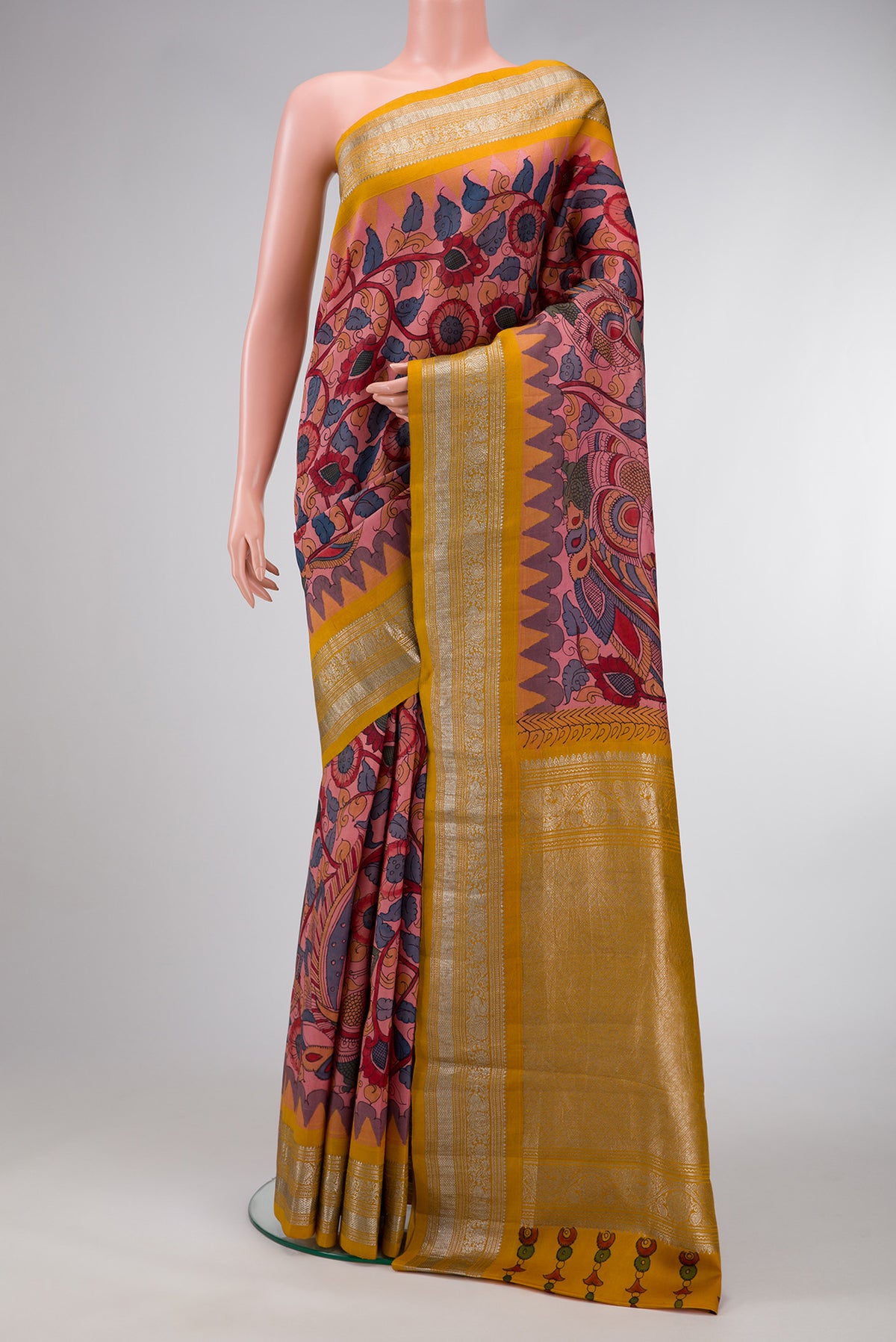 Rose Gold Dual Tone Kanchipuram Silk Saree with kalamkari Print on the body and Zari Border.  displayed on a mannequin