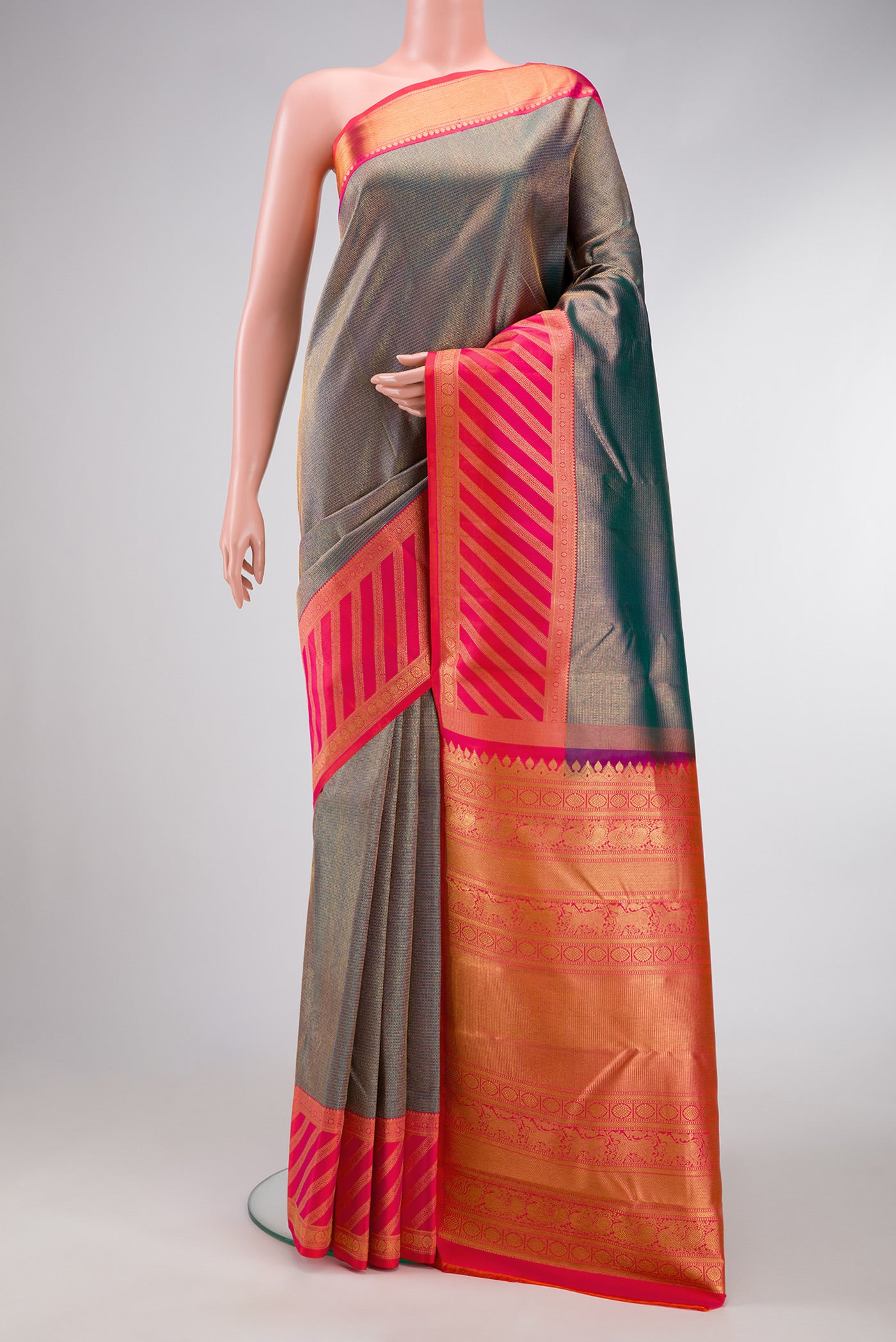 Peacock Blue Dual Tone Kanjivaram Silk Saree with Zari Brocade on the body and Fancy Border.  displayed on a mannequin