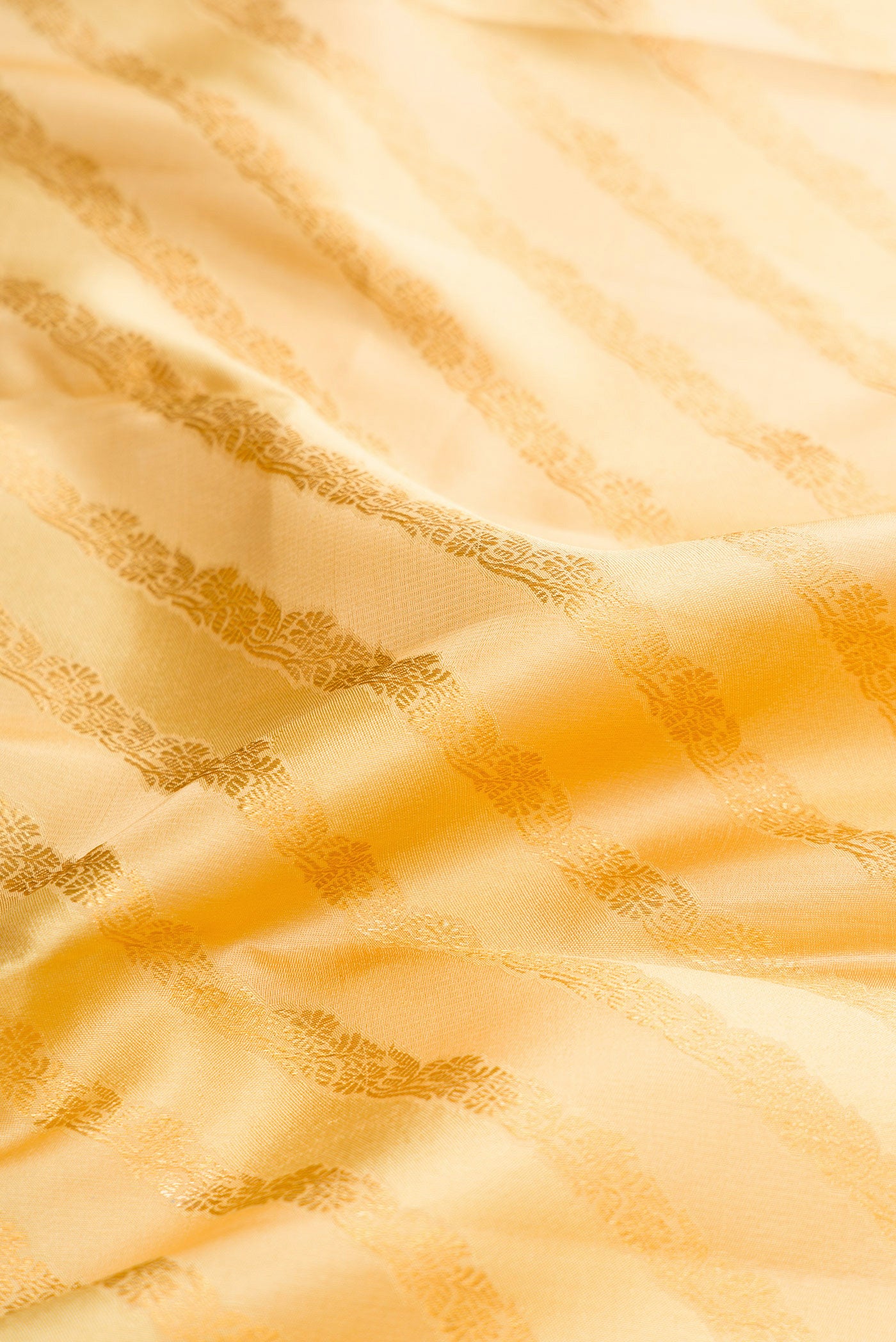 Close up of Sandal Dual Tone Kanjivaram Silk Saree with Zari Brocade on the body and Zari Border.  displaying folds