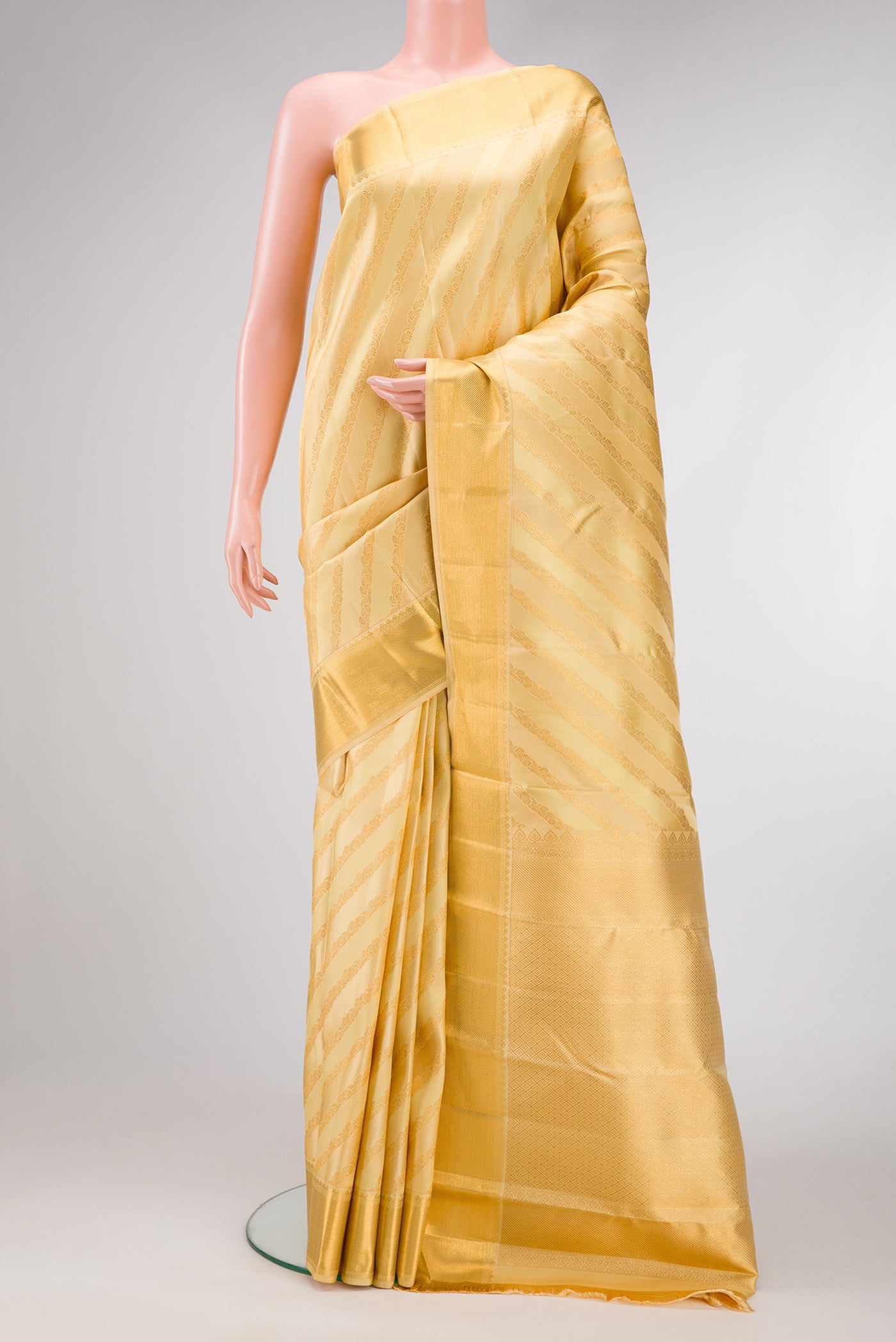 Sandal Dual Tone Kanjivaram Silk Saree with Zari Brocade on the body and Zari Border.  displayed on a mannequin